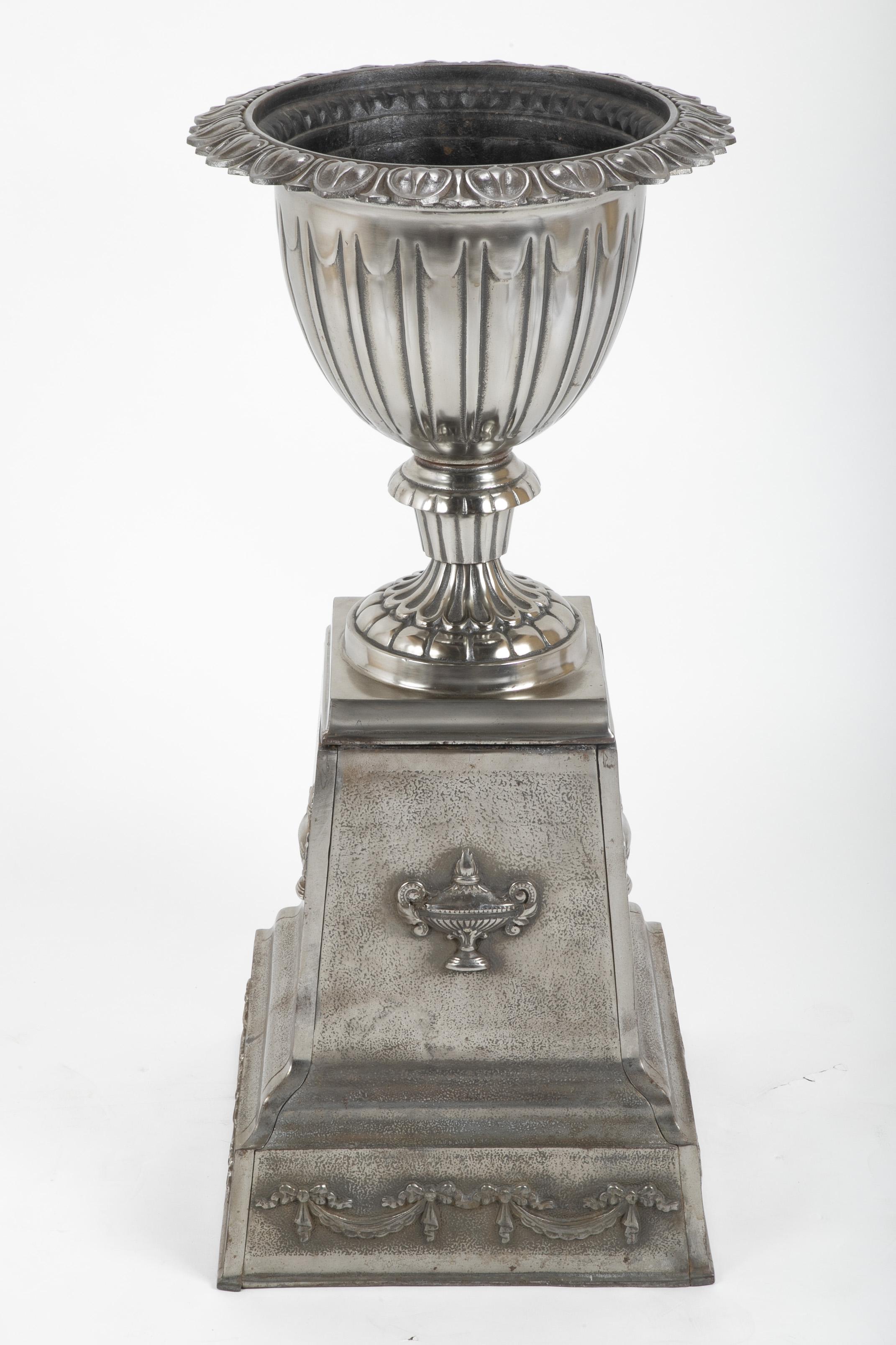 A polished cast steel garden urn. American, circa 1890.