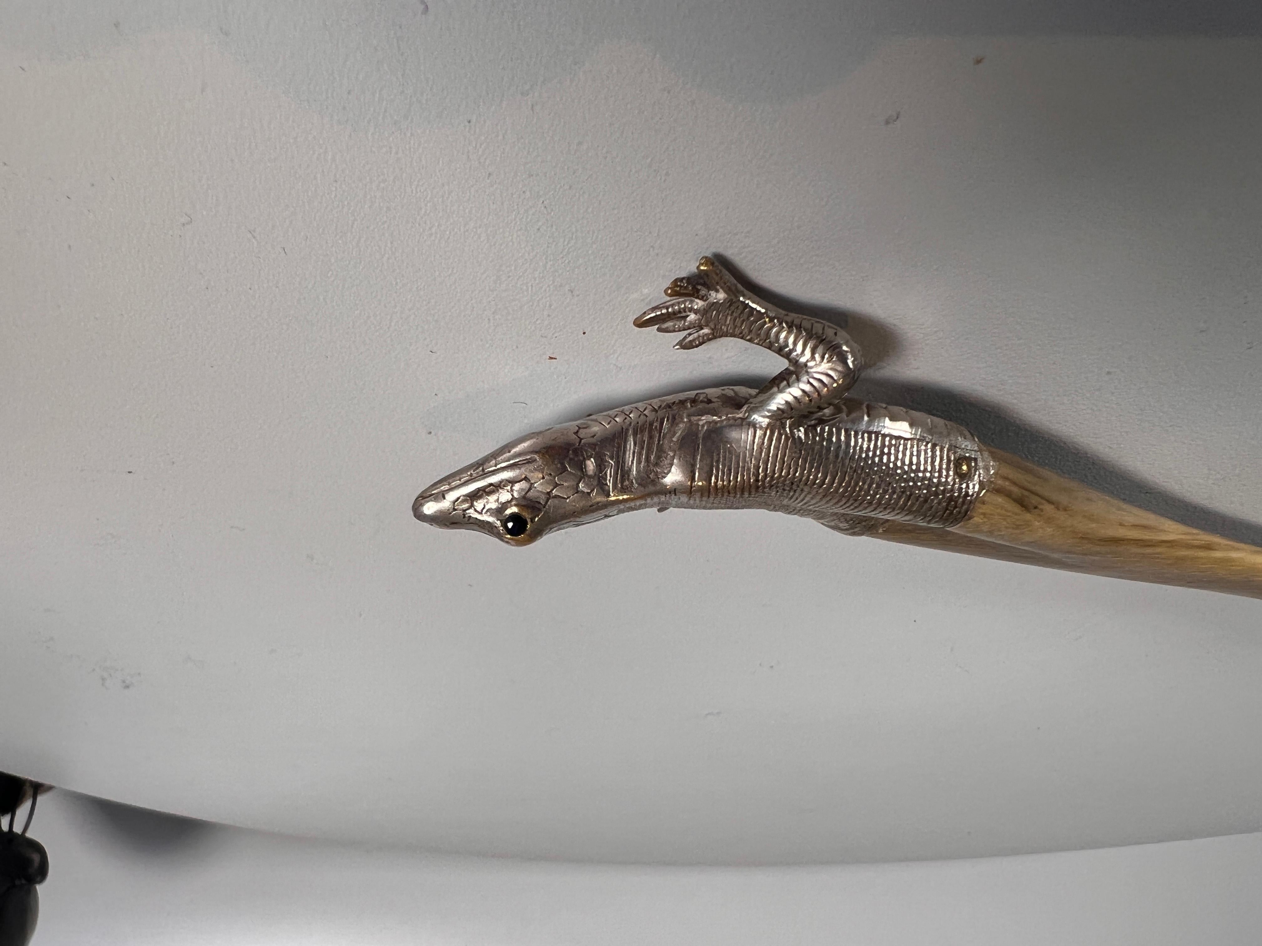 A wonderful quality Austro Hungarian letter opener in the form of a lizard - the realistically modelled lizard has inset glass eyes, the quality is superb and gives the lizard a very tactile and realistic feel.