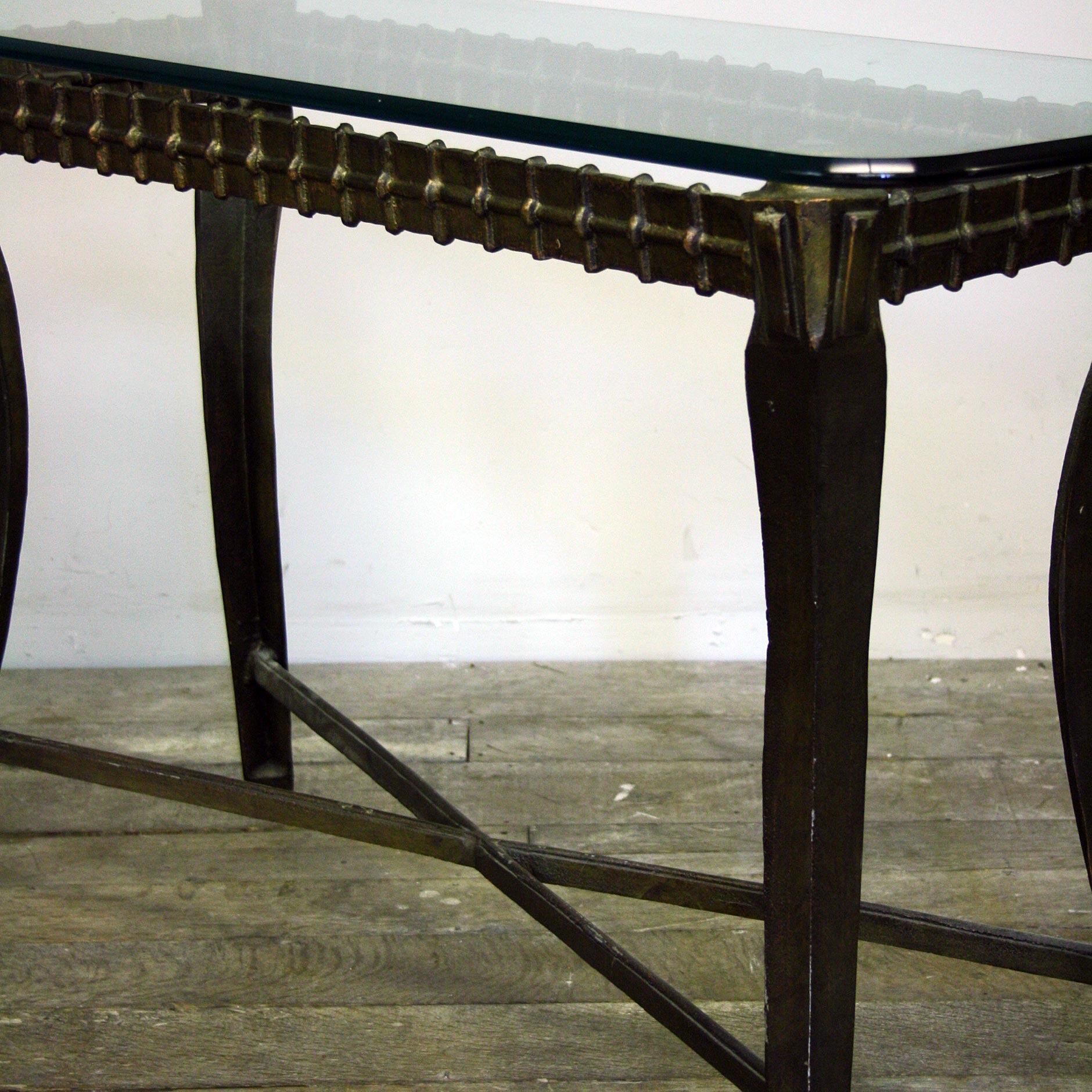 Looking for something different? A late 20th Century Brutalist wall console, metal base with a very heavy glass top.