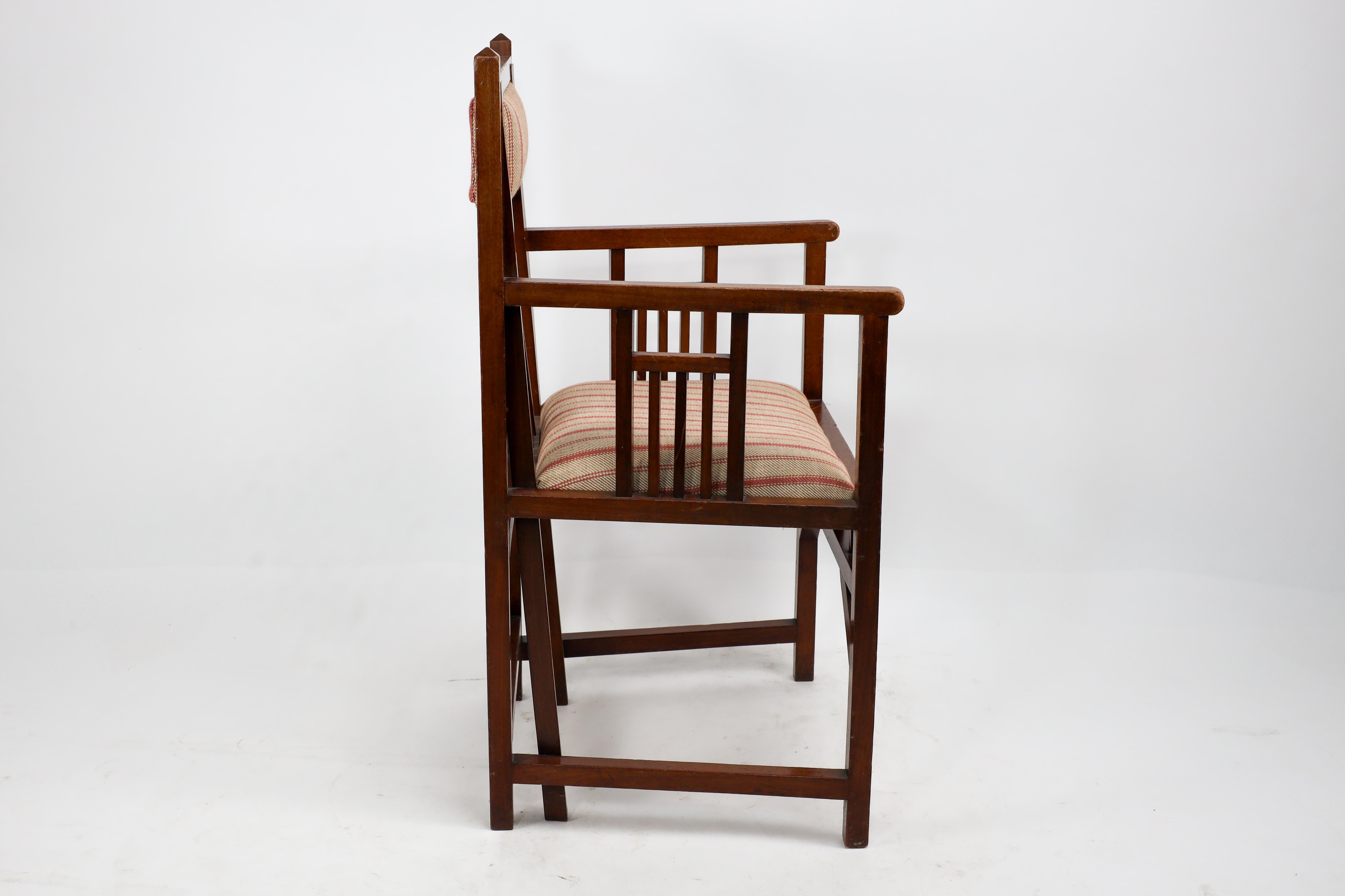 English Bombay Art Furniture An Anglo-Japanese Walnut armchair with a double back leg. For Sale