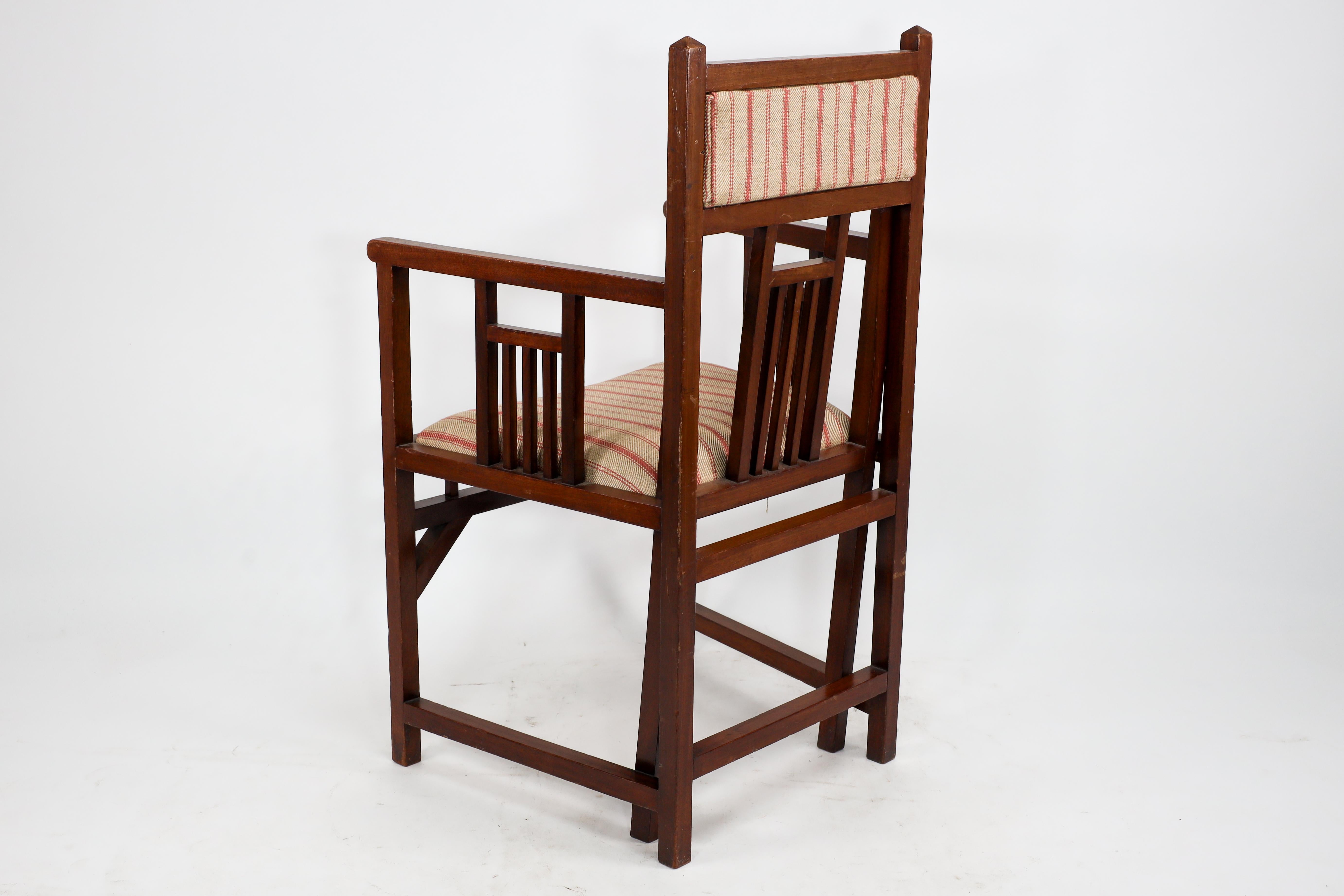 Early 20th Century Bombay Art Furniture An Anglo-Japanese Walnut armchair with a double back leg. For Sale