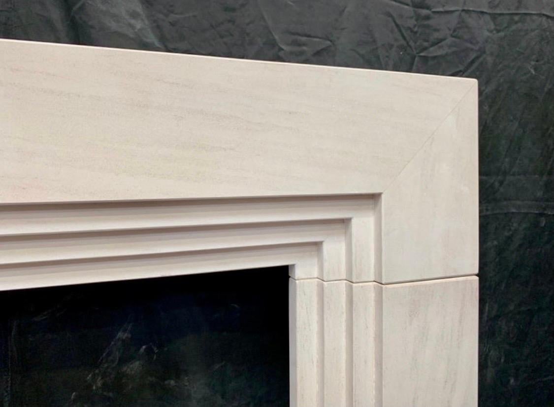 Carved Late Edwardian Stepped Limestone Fireplace Surround in the Art Deco Manner For Sale