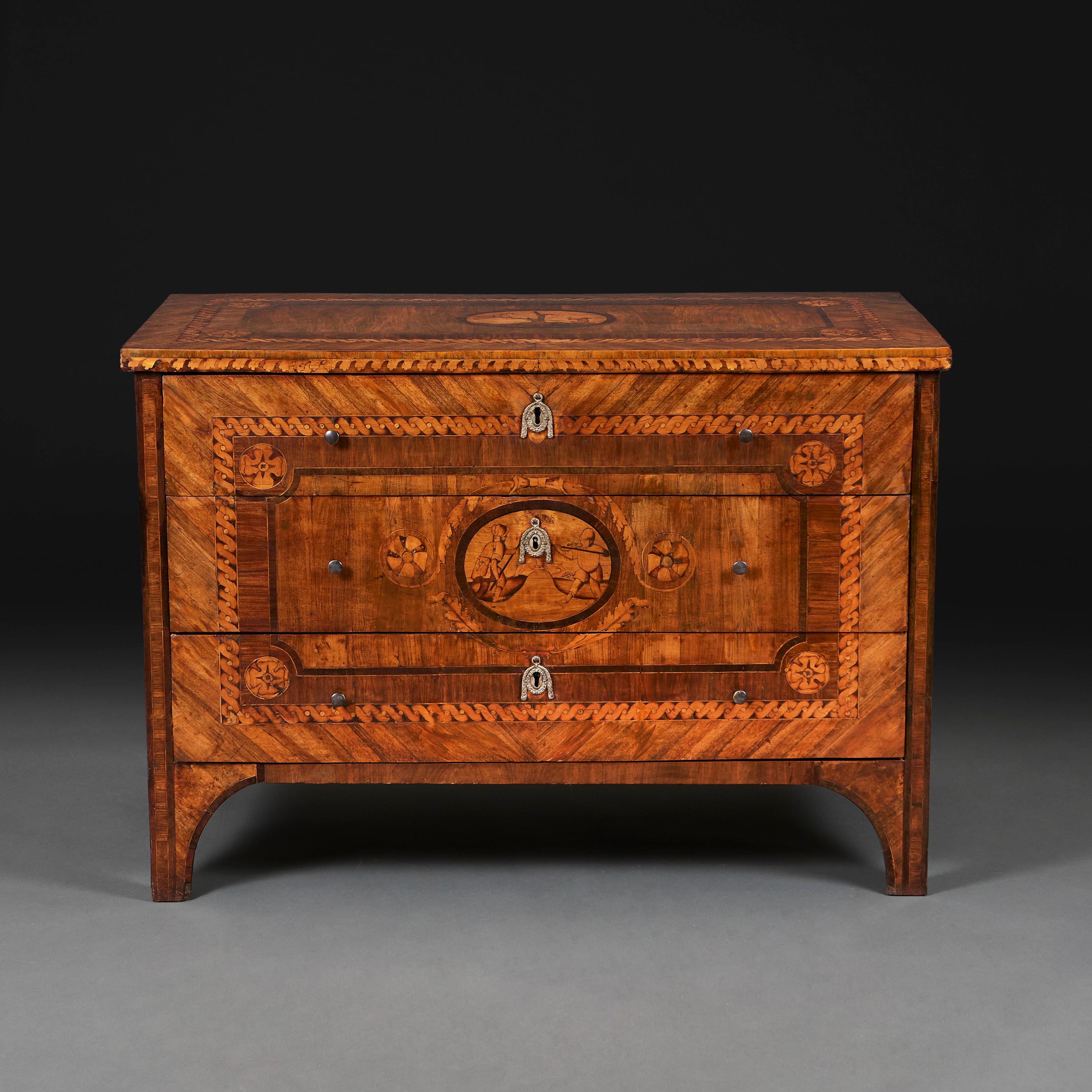 taly, circa 1790

A fine late eighteenth-century walnut marquetry commode inlaid with exotic timbers, rectangular guilloche motifs, the central draw with parquetry of figures in a naturalistic setting, all supported on raised bracket feet.

 Height