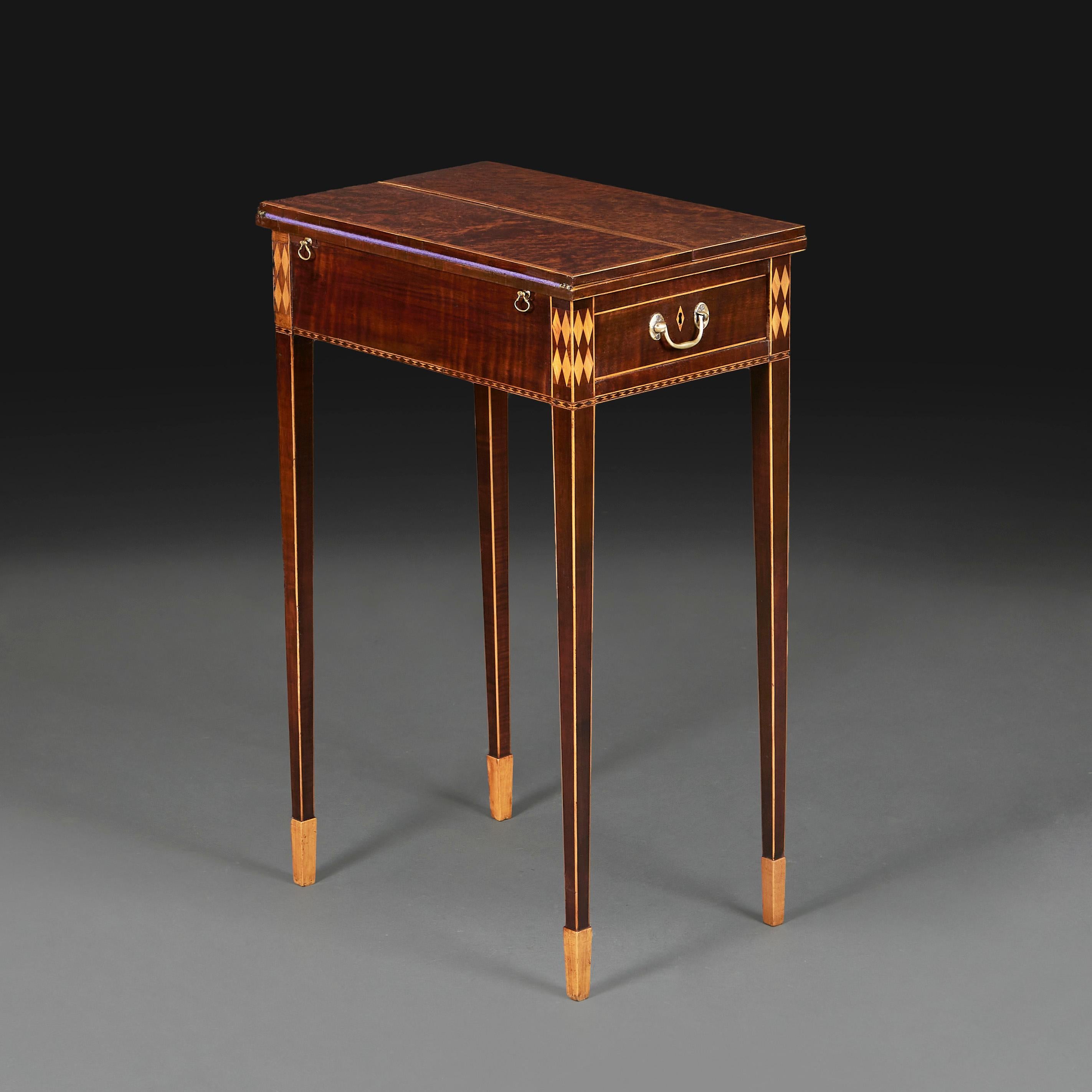 England, circa 1790

A very fine rectangular late eighteenth century writing table, the top veneered with burr mulberry, with four lopers to support the open top, single drawer to the frieze, harlequin marquetry decoration throughout, supported on