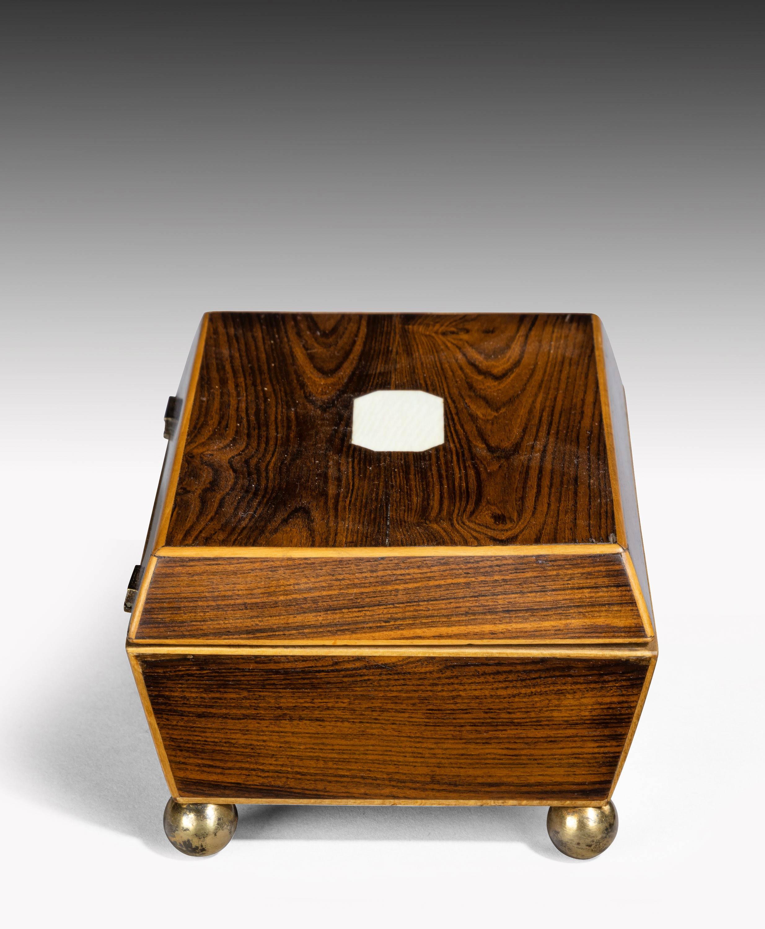 A purple heart box, late George III period. With original ball feet and diamond shape escutcheon.
 