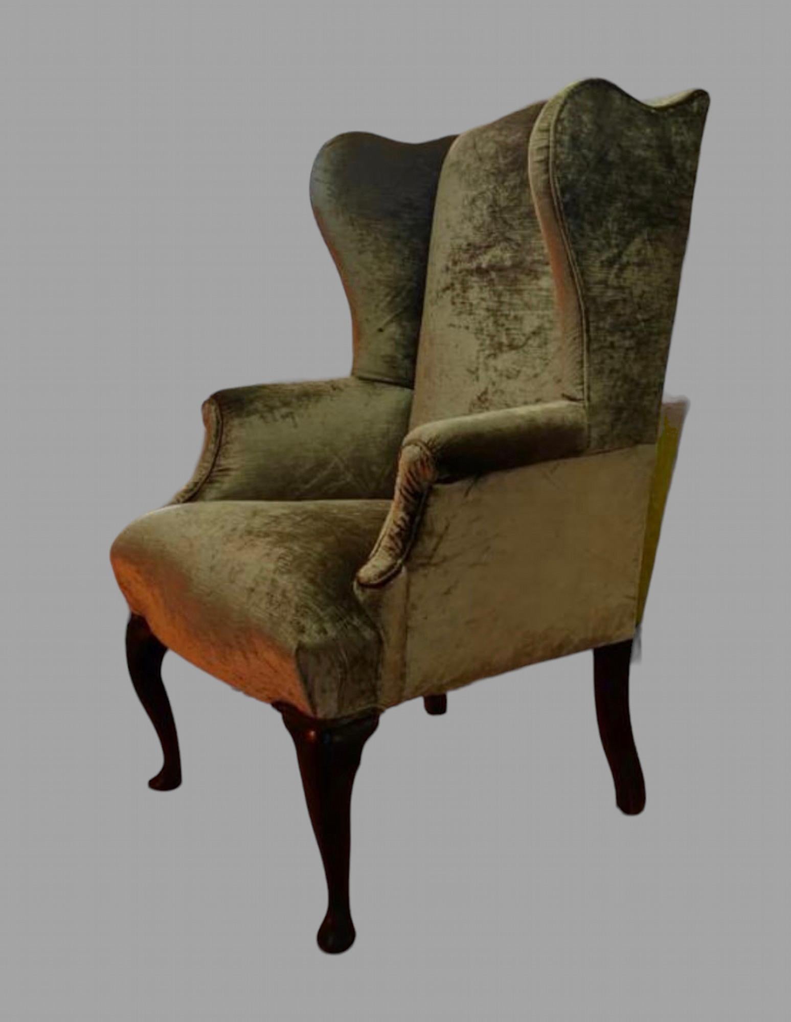 A Late Georgian Mahogany Wingback Chair with Queen Anne Legs reupholstered in GP&J Baker Rossini Velvet.