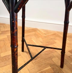 A late nineteenth century bamboo table with tripod legs