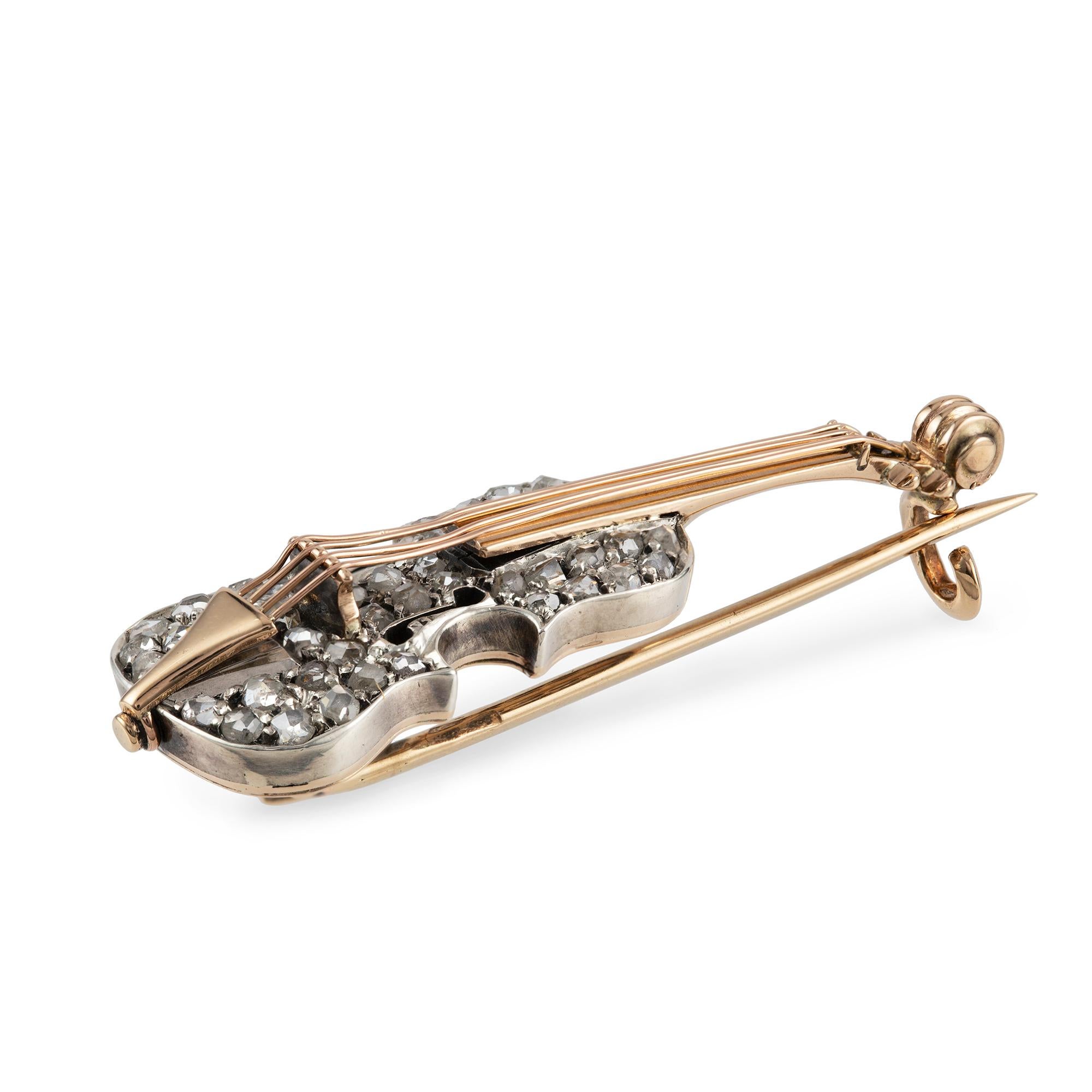 A late nineteenth century diamond brooch, finely modelled in the form of a violin, the body encrusted with rose-cut diamonds and the strings, neck and head in rose gold, French Import mark to the brooch pin, circa 1890, measuring approximately