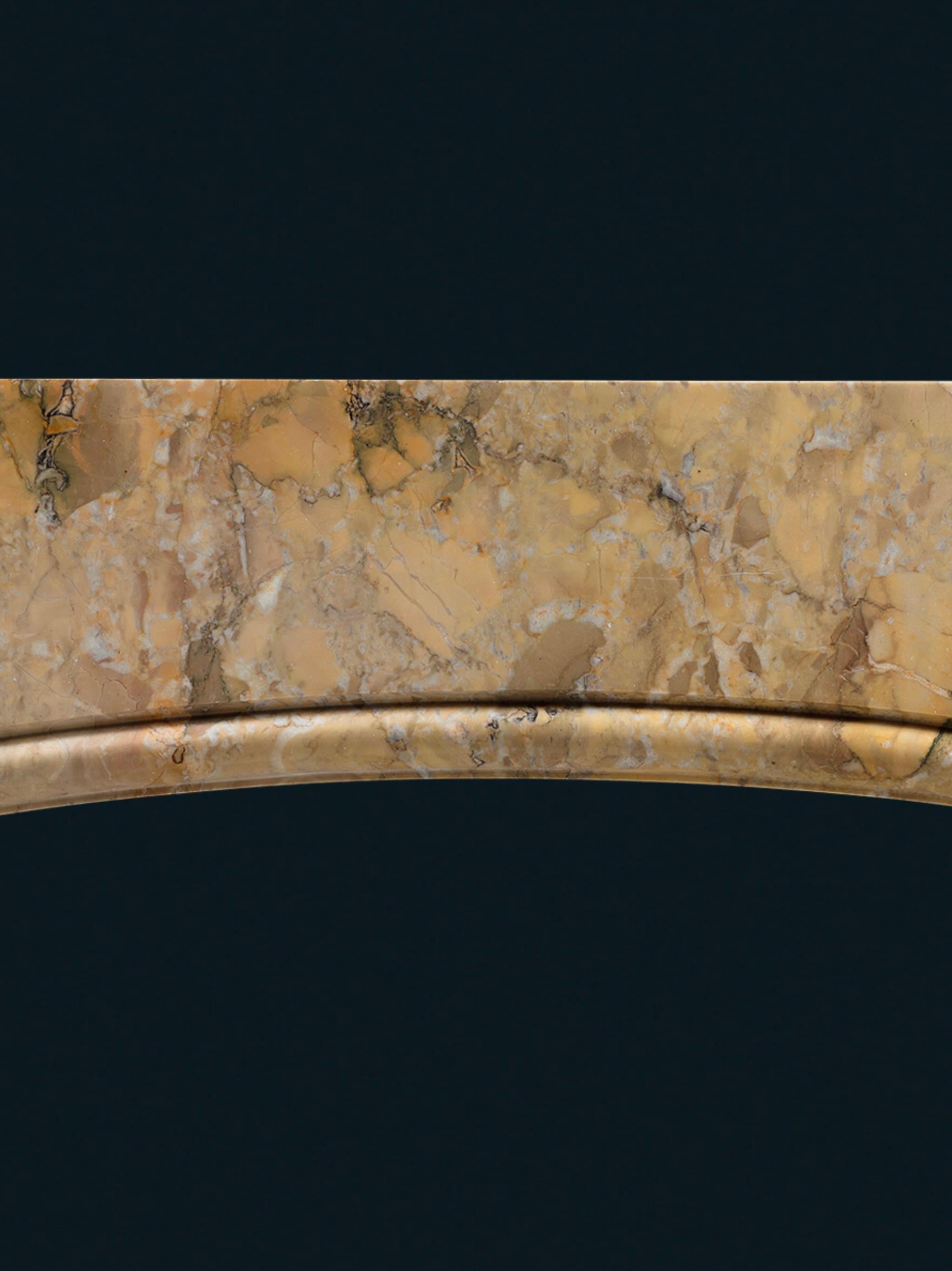 English A Late Nineteenth Century Frame Chimneypiece Carved from Solid Sienna Marble For Sale