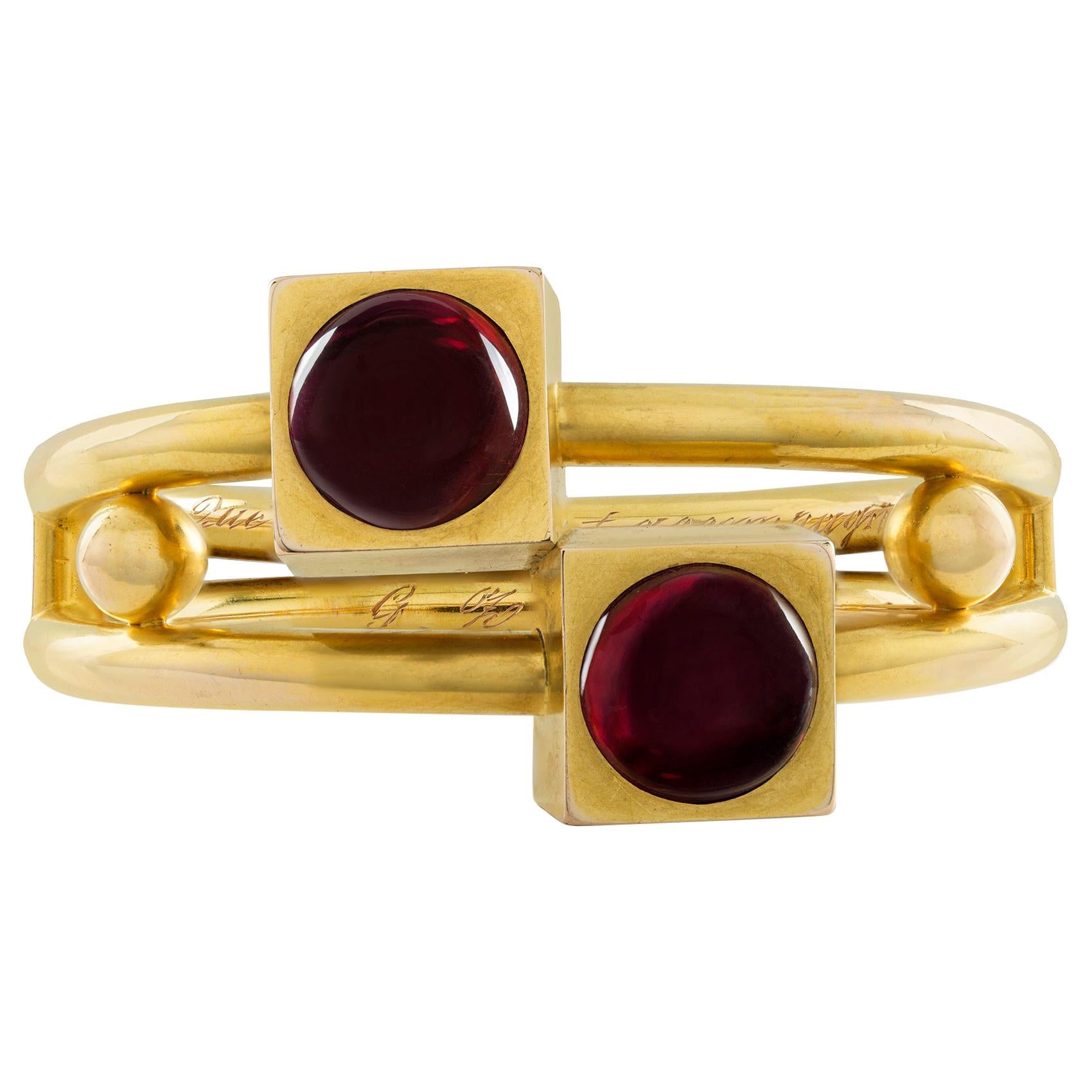 A Late Nineteenth Century Gold and Garnet Bangle For Sale