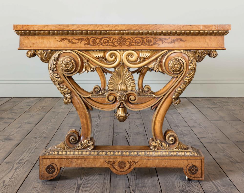 A Late Regency Birdseye Maple Table

With parcel gilt and purple heart inlay, in the manner of Morel and Seddon.
c. 1825

Provenance: Littlecote House, Hungerford, Wiltshire

Height: 77 cm, 30 1/4″
Width: 214 cm, 84 1/4″
Depth: 104 cm, 41″