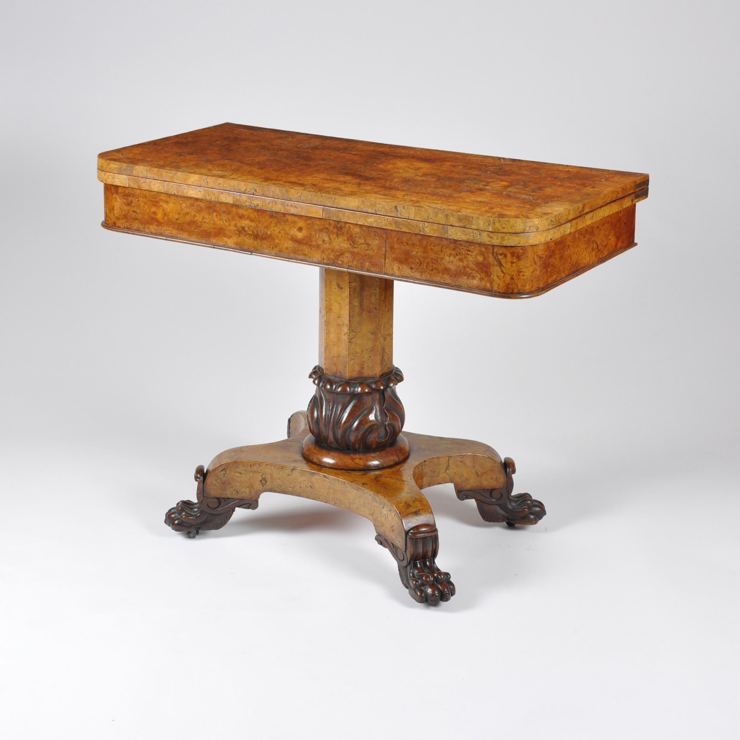 A wonderful late Regency burr elm and oak cross-banded card table, of superb colour and patina. The D-shaped top is of exceptional quality burr elm, standing on an octagonal support originating from a stylised bulb like carving.

The burr elm base