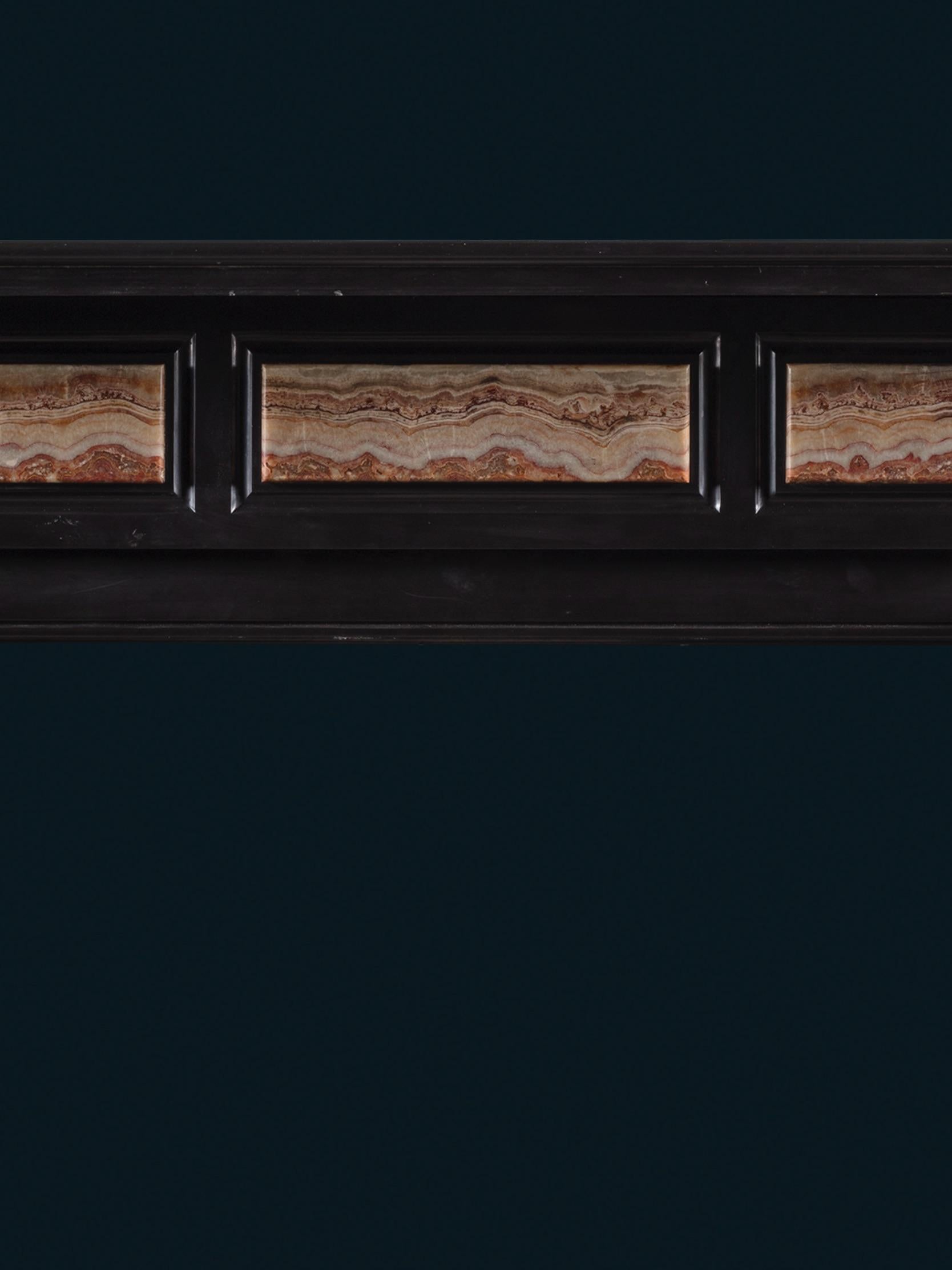 English A Late Regency Chimneypiece Carved from Belgium Black Marble with Specimen Onyx For Sale