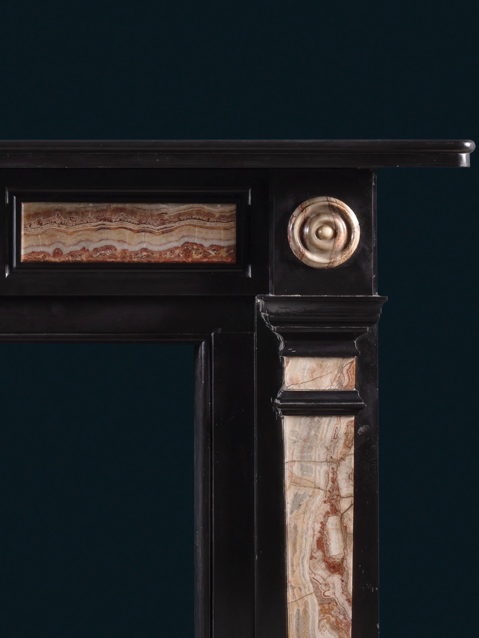 A Late Regency Chimneypiece Carved from Belgium Black Marble with Specimen Onyx In Good Condition For Sale In London, GB