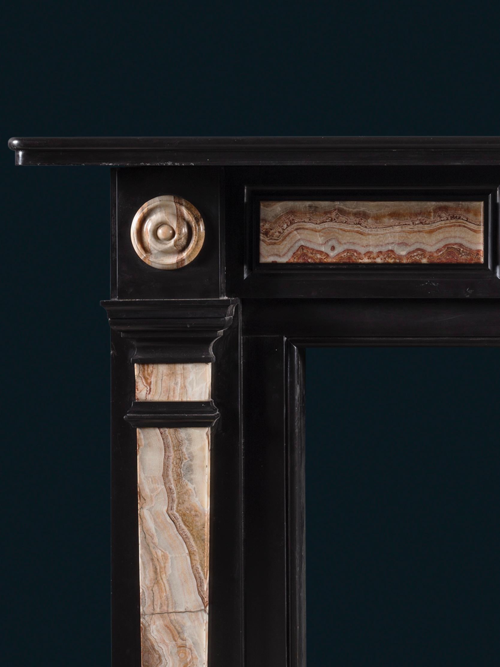 A Late Regency Chimneypiece Carved from Belgium Black Marble with Specimen Onyx For Sale 1