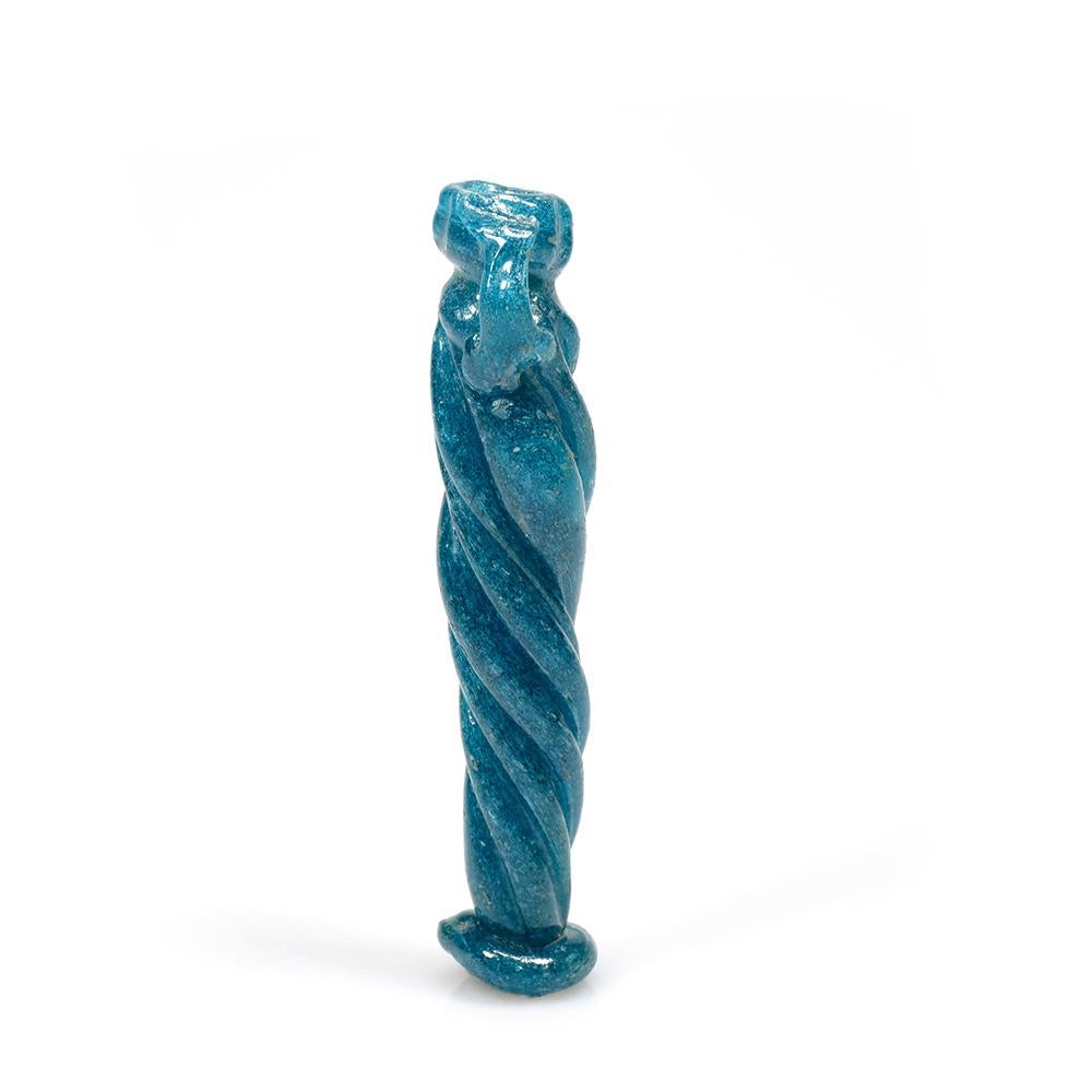 Glass balsamarium with a twisted tubular body, tapering towards the applied disc base, with two trailed handles
 
12.0 cm (h)
 
Provenance:
Ex anonymous Sale; Pierre Bergé Auctioneers, Paris, 17 January 2009, lot 38
 
Roman glass was used primarily