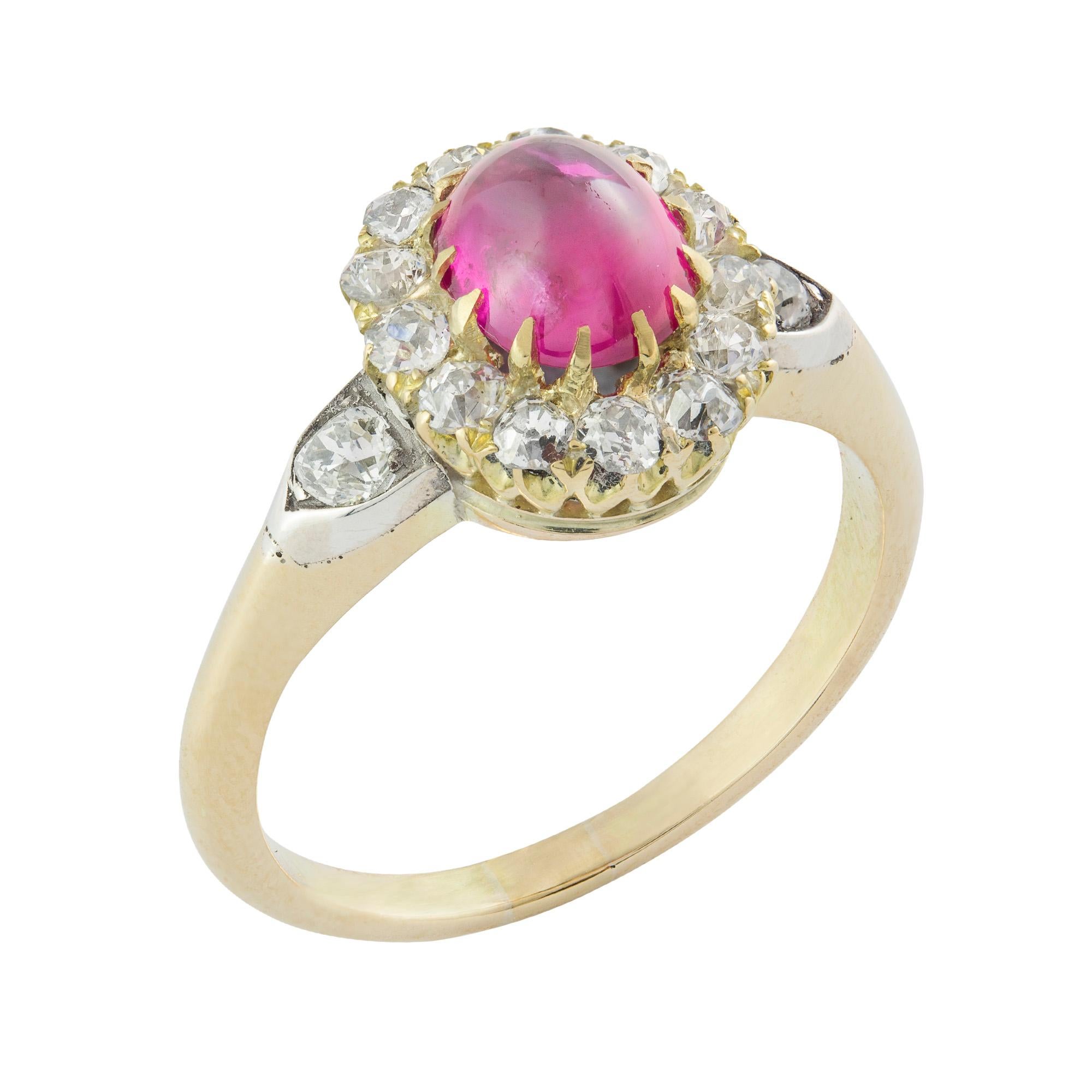 A late Victorian cabochon ruby and diamond cluster ring, the oval cabochon-cut ruby weighing 1.38 carats, accompanied by GCS Report stating to be of Burmese origin with no heat, to an old brilliant-cut diamond surround and diamond set shoulders, the