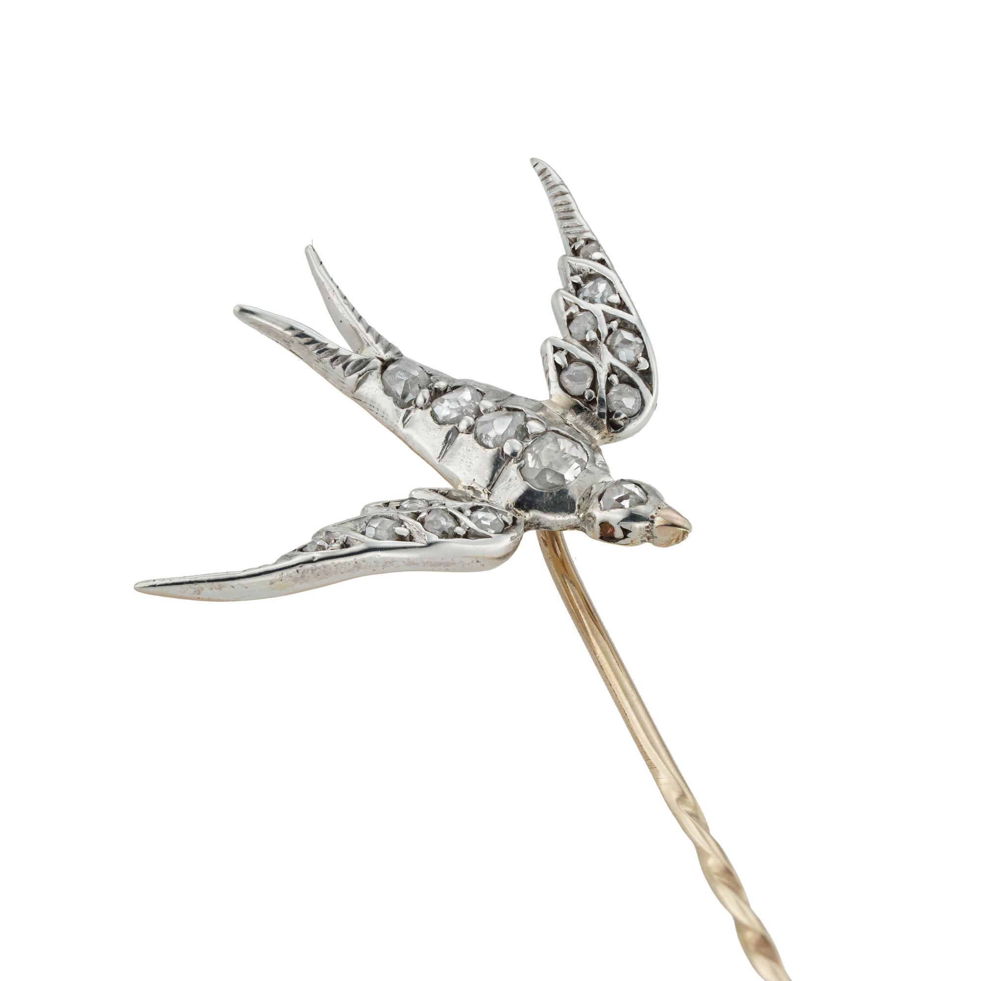 A late Victorian diamond-set swallow stick-pin, the nineteen rose-cut diamonds set in silver to yellow gold back, with gold pin fitting, measuring approximately 2.8 x 2.1cm, the pin measuring 6.8cm long, gross weight 2.4g.
 A sweet late Victorian
