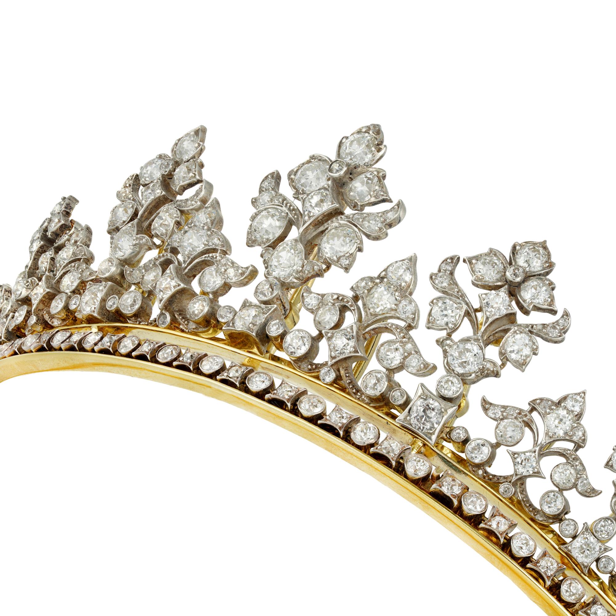A late Victorian diamond-set tiara, consisting of seven large floral motifs graduating in size from the centre, alternating with eight smaller motifs of foliate design, the base with a diamond-set line with round and square collets, the tiara is set
