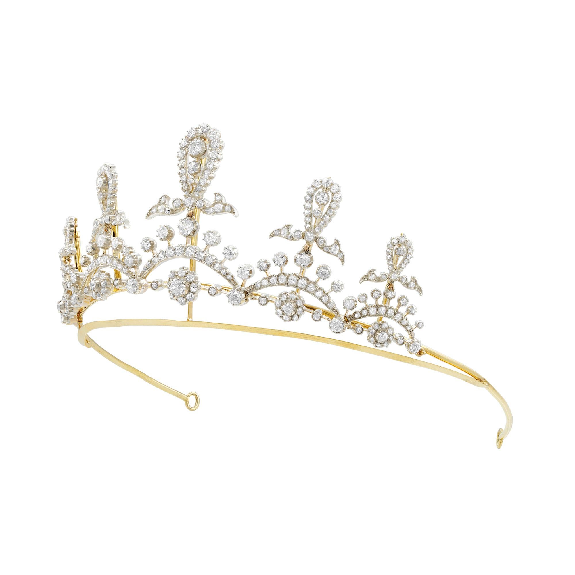 A late Victorian diamond-set tiara, the five openwork foliate garland design sections graduating in size from the centre, each featuring three old-European cut diamonds within a pear-shaped diamond-set surround, the bottom section with five curved