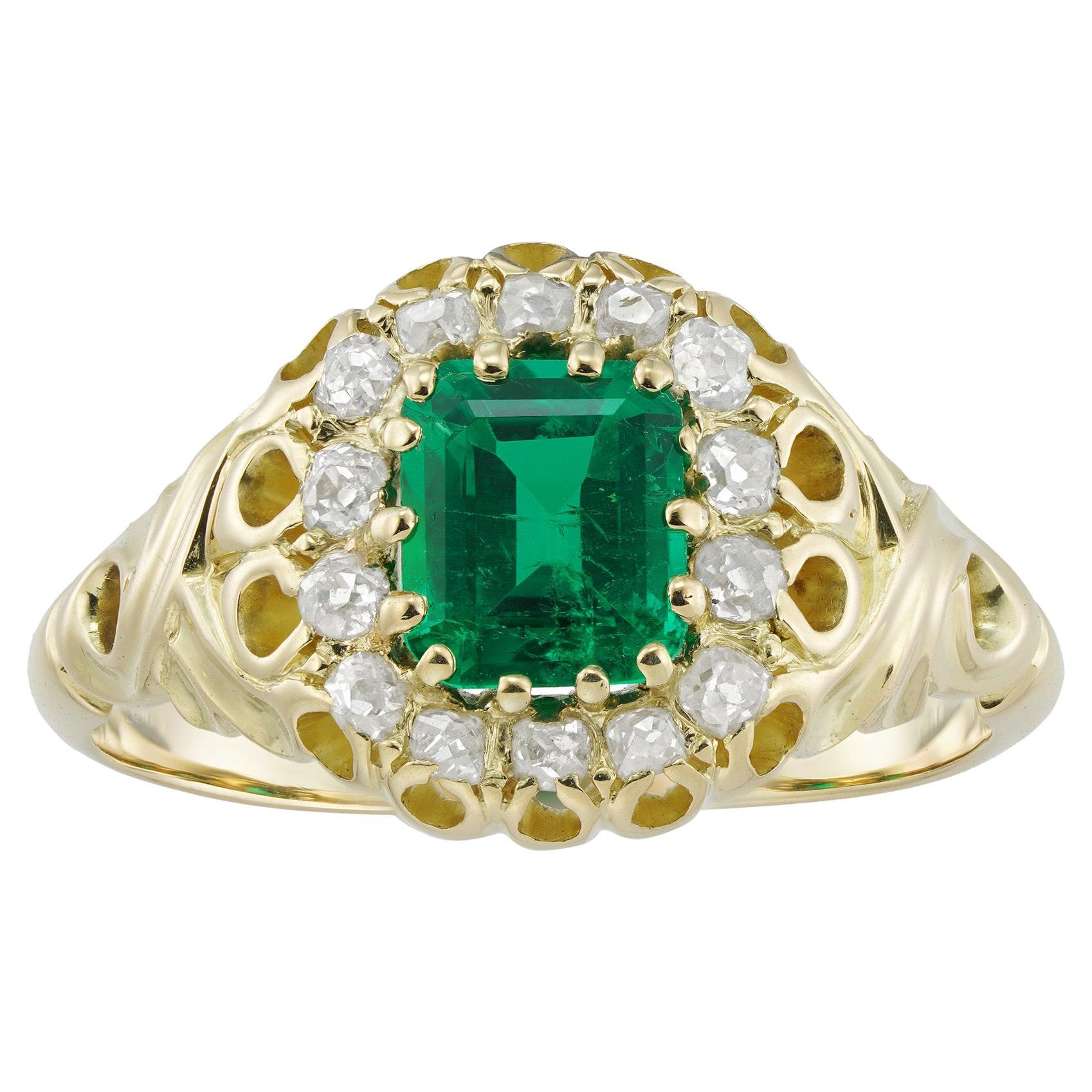 A Late Victorian Emerald And Diamond Cluster Ring For Sale