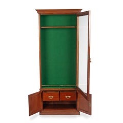 A late Victorian faded mahogany gun cabinet