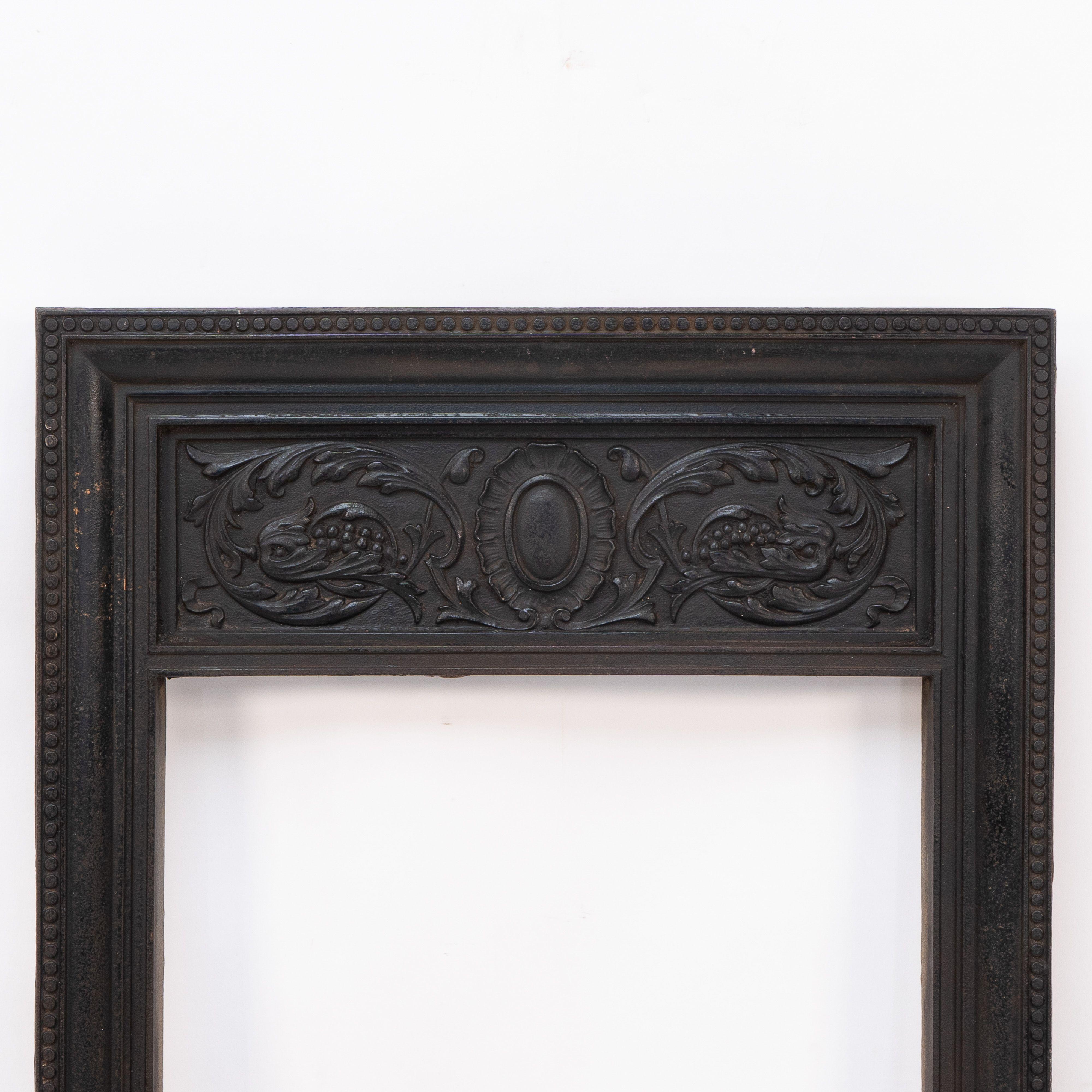 A late Victorian fire with stylized floral details to the top. Designed to have tiles down each side or used as is. Registered Design 274519; Dimensions of opening: 60 cm x 35 cm