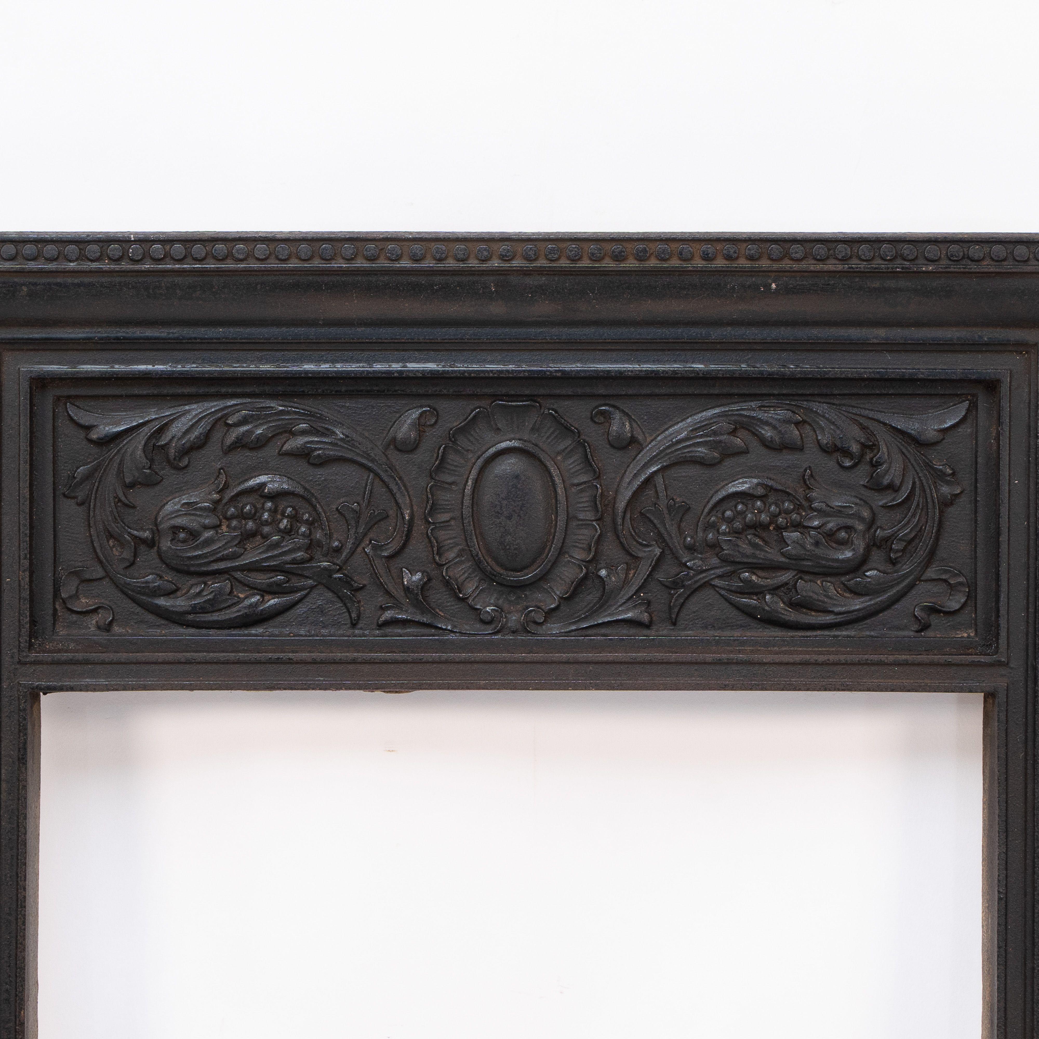 Late Victorian A late Victorian fireplace with stylized floral details to the top For Sale