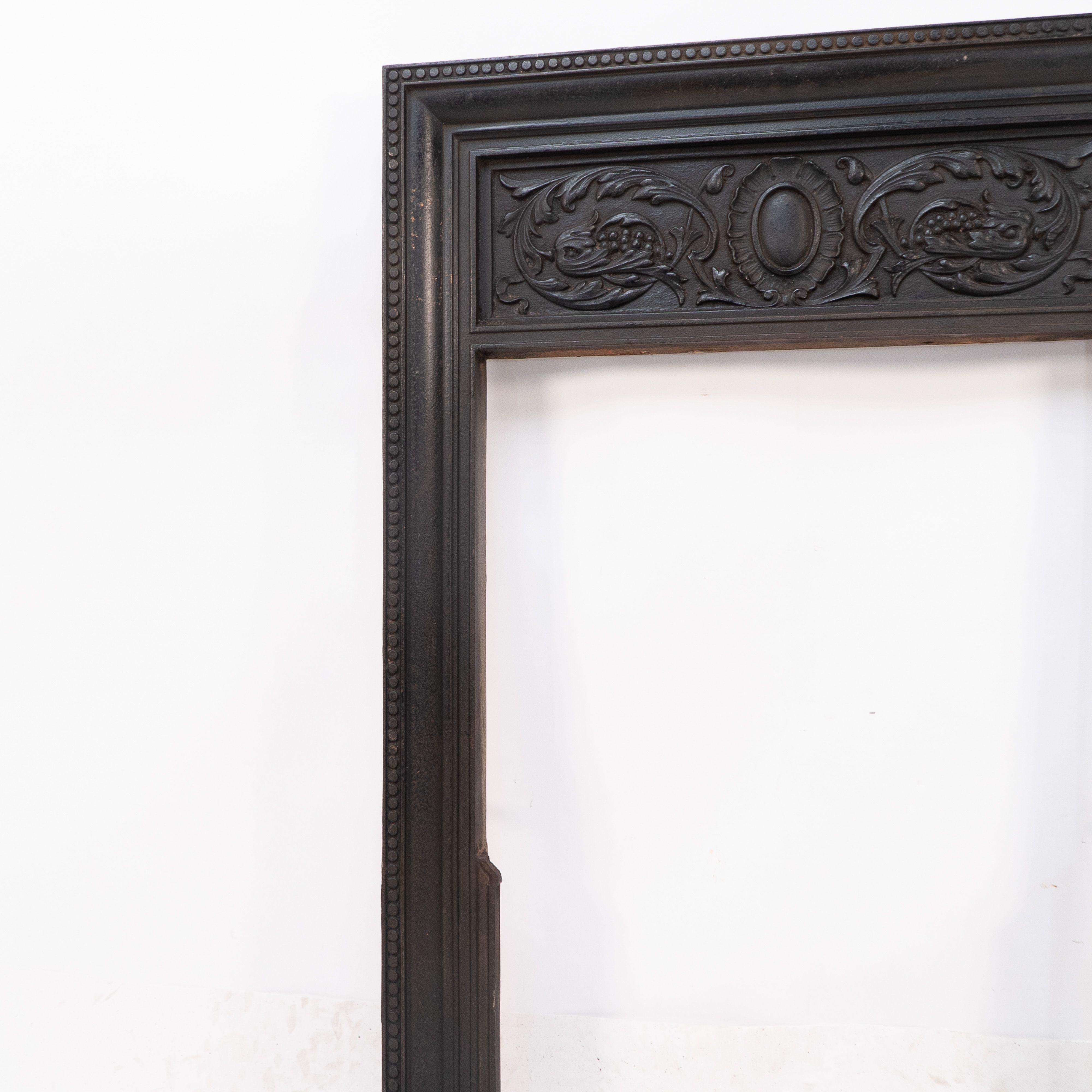 Iron A late Victorian fireplace with stylized floral details to the top For Sale