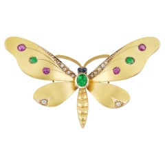 A late Victorian gold and gem-set butterfly brooch
