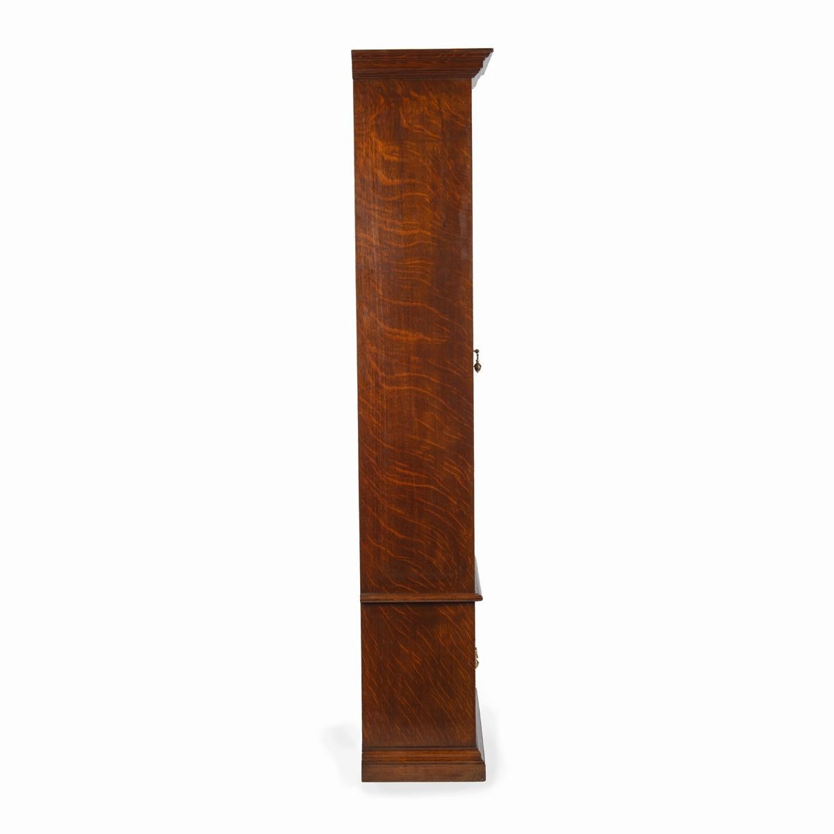 A late Victorian oak gun cabinet 5