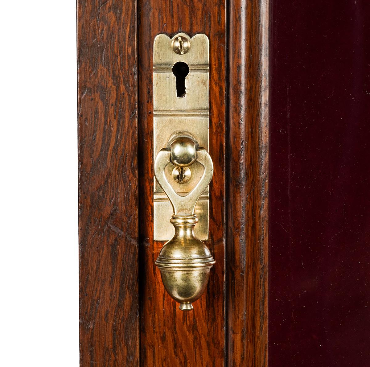 A late Victorian oak gun cabinet 8