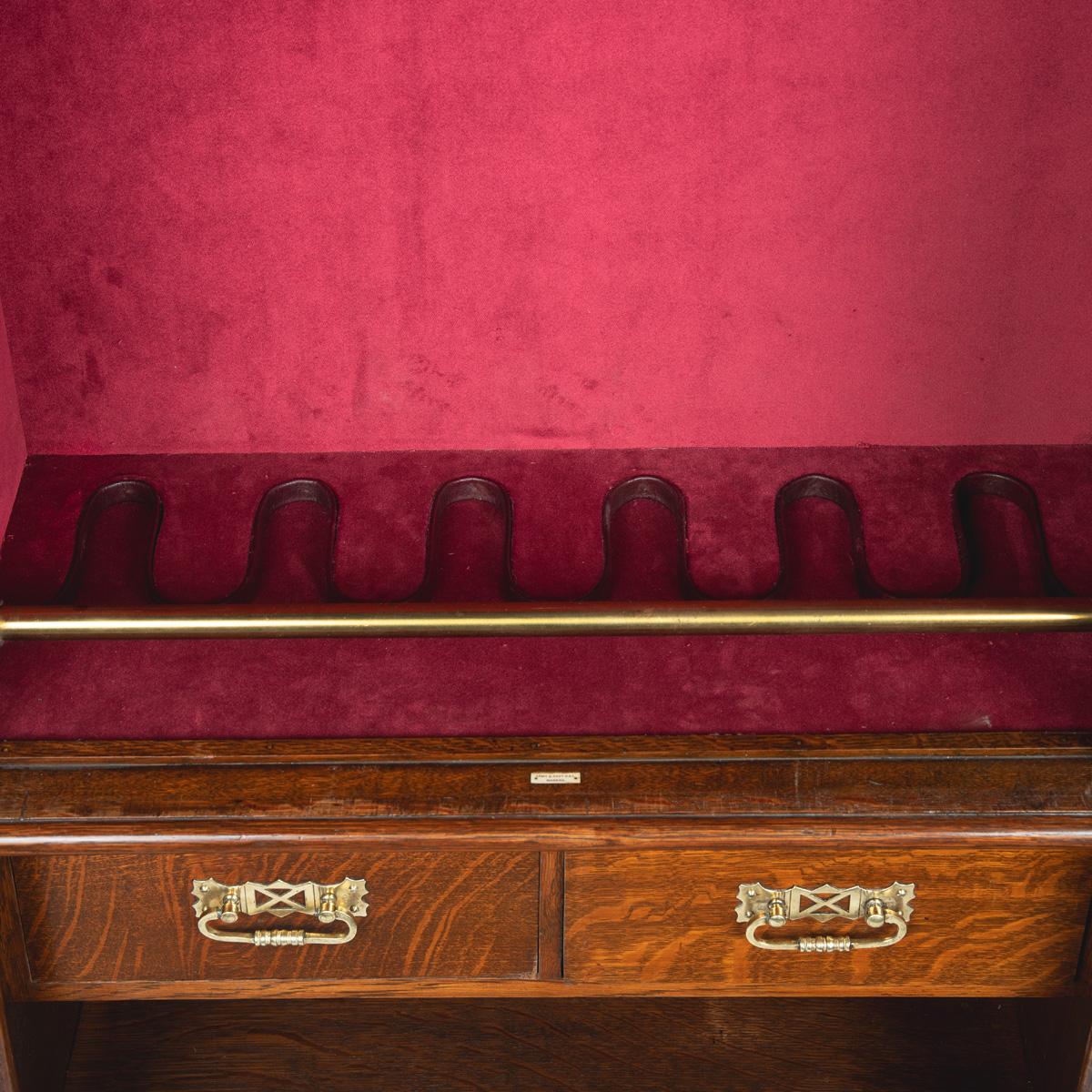 A late Victorian oak gun cabinet 1