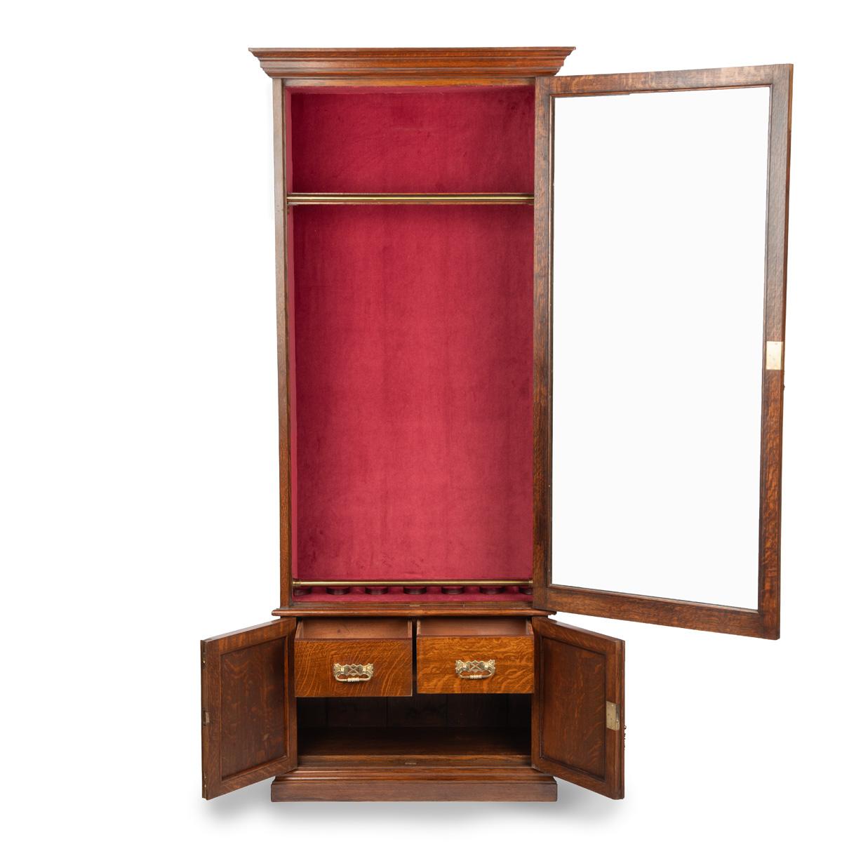 A late Victorian oak gun cabinet 2