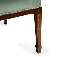 A late Victorian satinwood wheel back settee in the Chippendale style