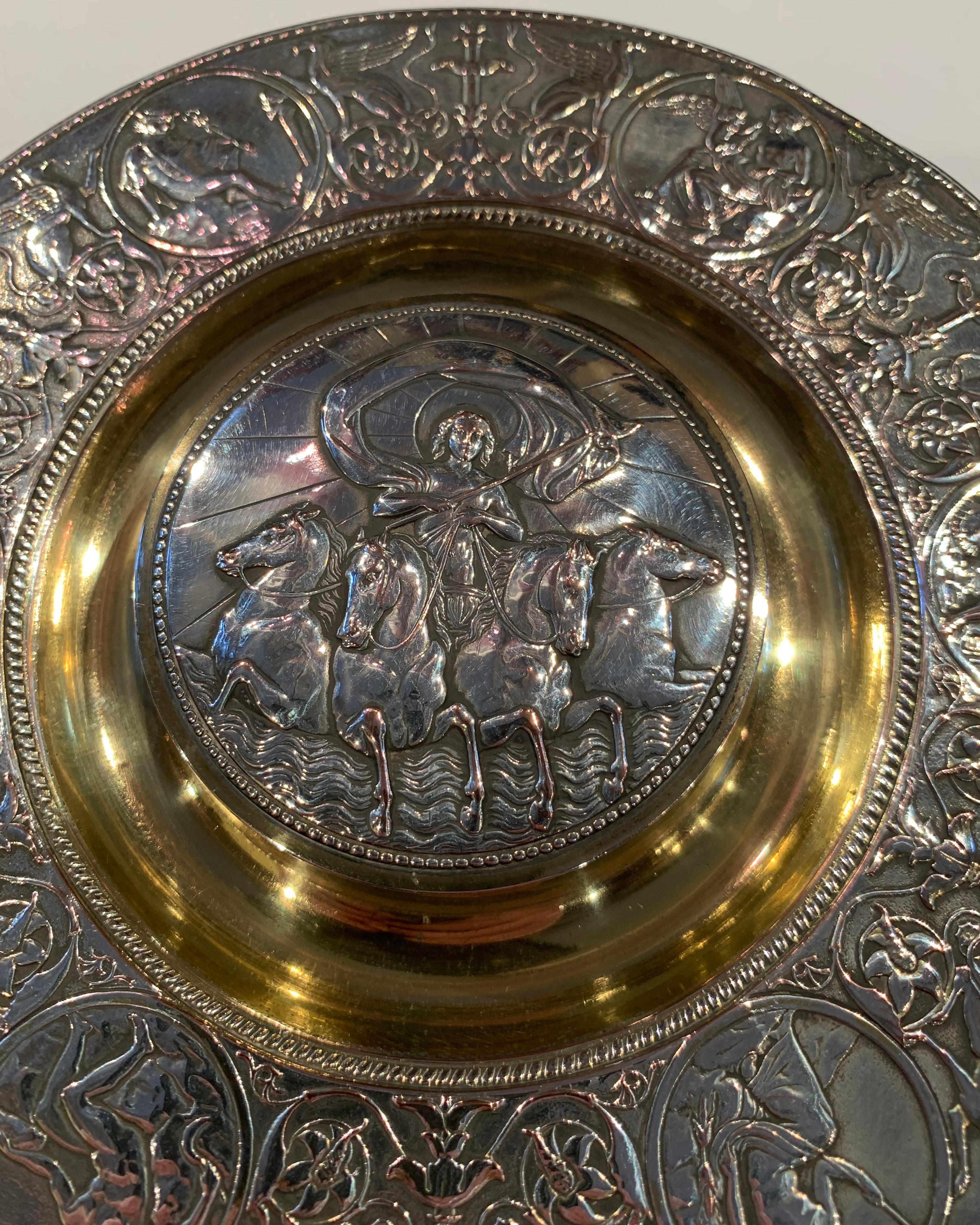 A delightful silver plate and gold wash Caviar dish by Elkington & Co circa 1890.

The lift up central lid, depicting Boadicea on her Chariot. The surrounding edge depicting classical scenes, figures and griffins.

It really is a very nice