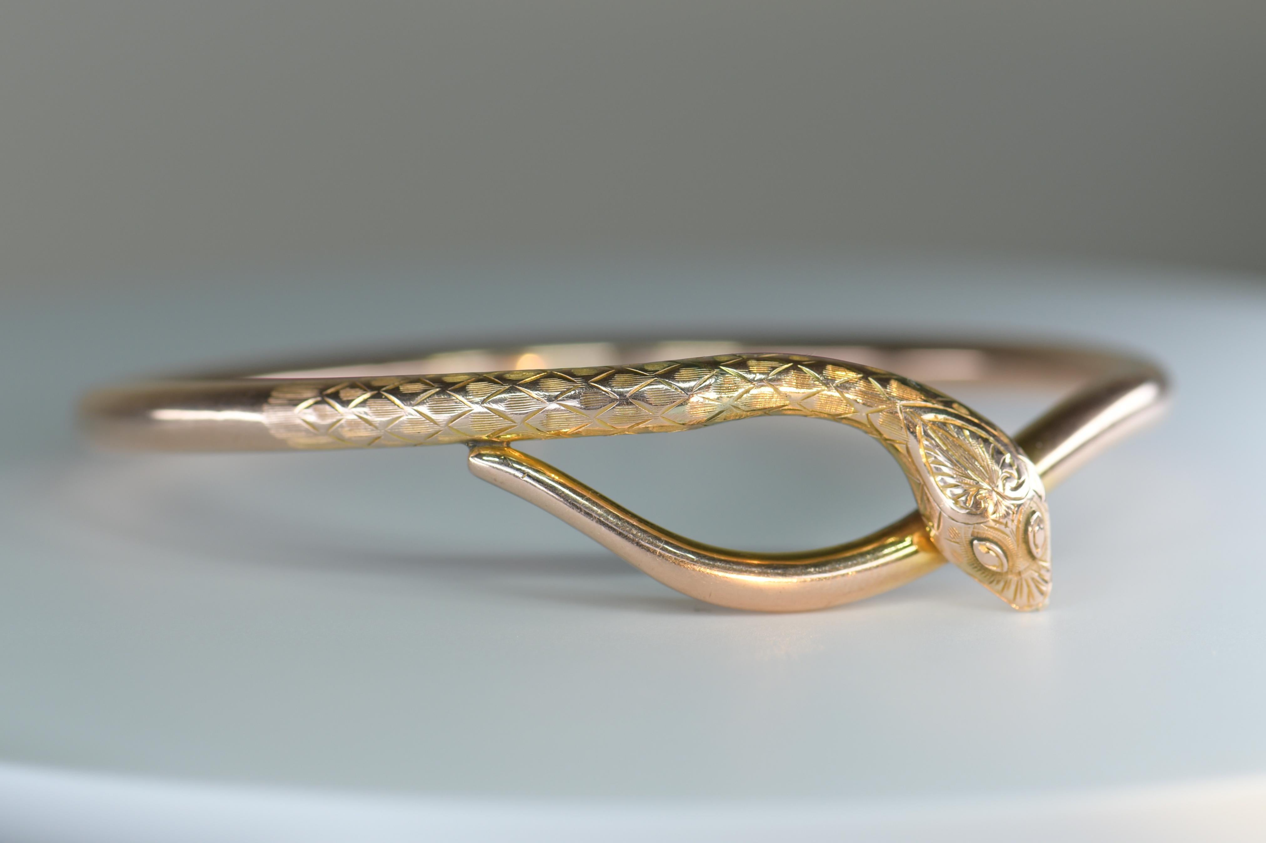 A very attractive Victorian snake bangle and armband. It was modeled as a coiled snake with engraved detail to head. Snake motifs are one of the earliest historical and mythological symbols that had significance in almost every culture.
