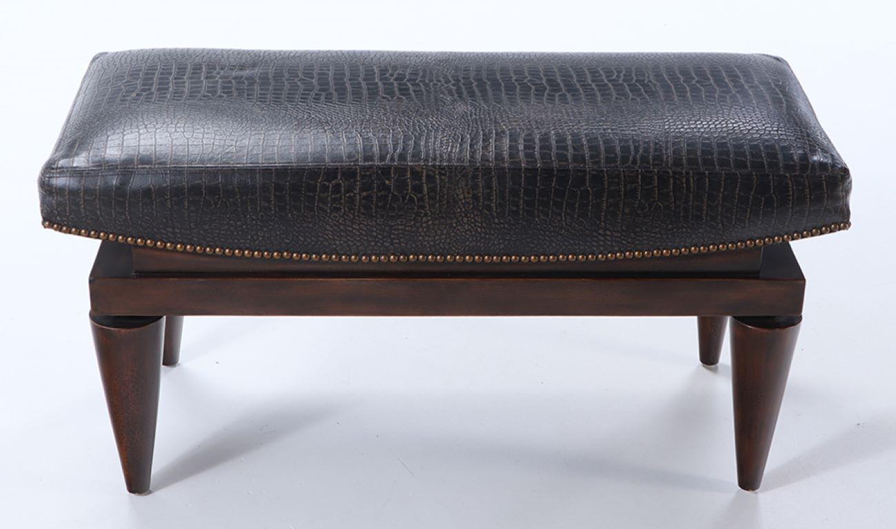 A leather covered mahogany bench with alligator design in the manner of Andre Arbus circa 1960.