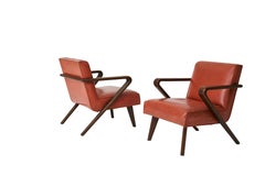 A Leather Wrapped Desk and Matching Arm Chairs designed by William Haines