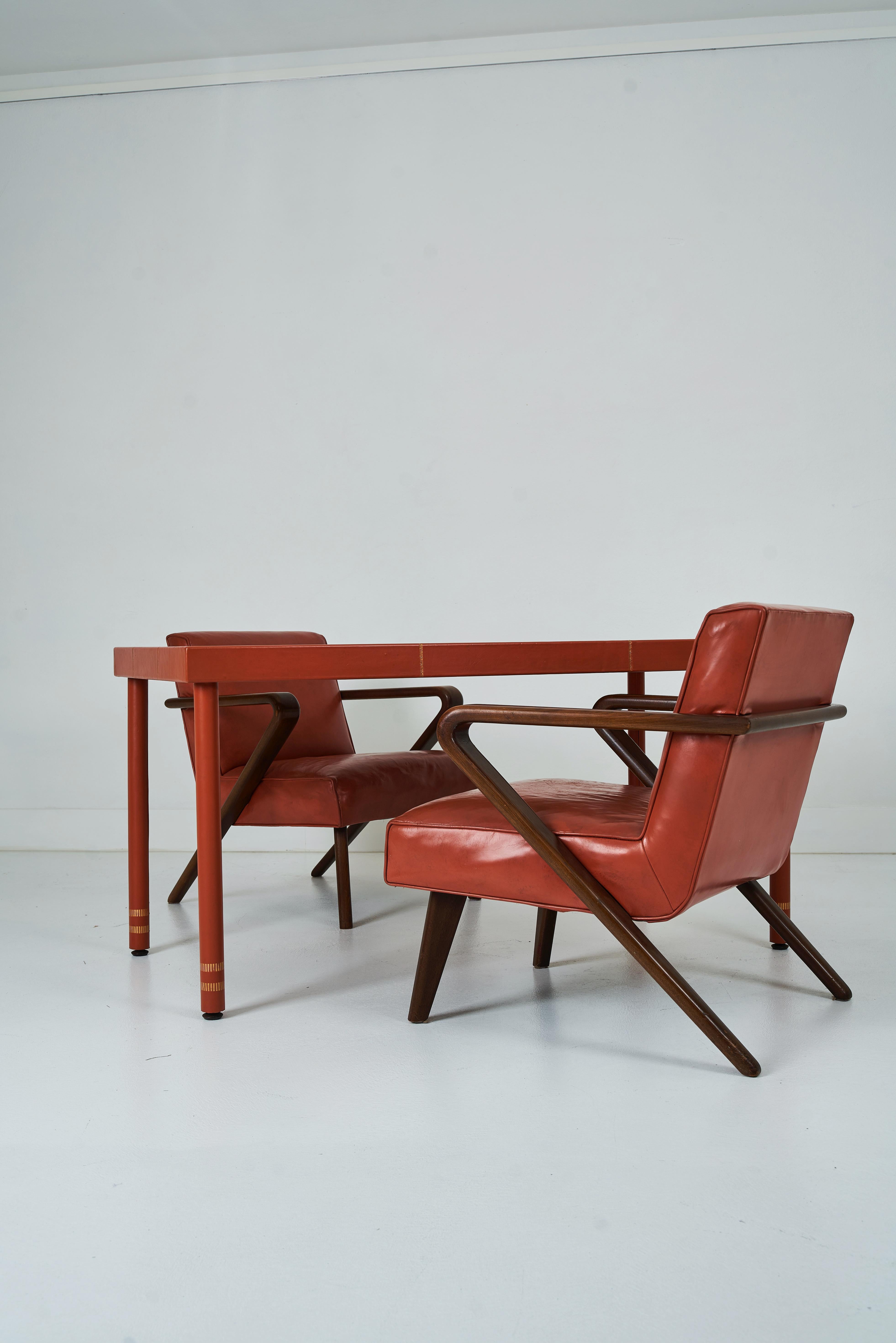 Mid-Century Modern A Leather Wrapped Desk and Matching Arm Chairs designed by William Haines