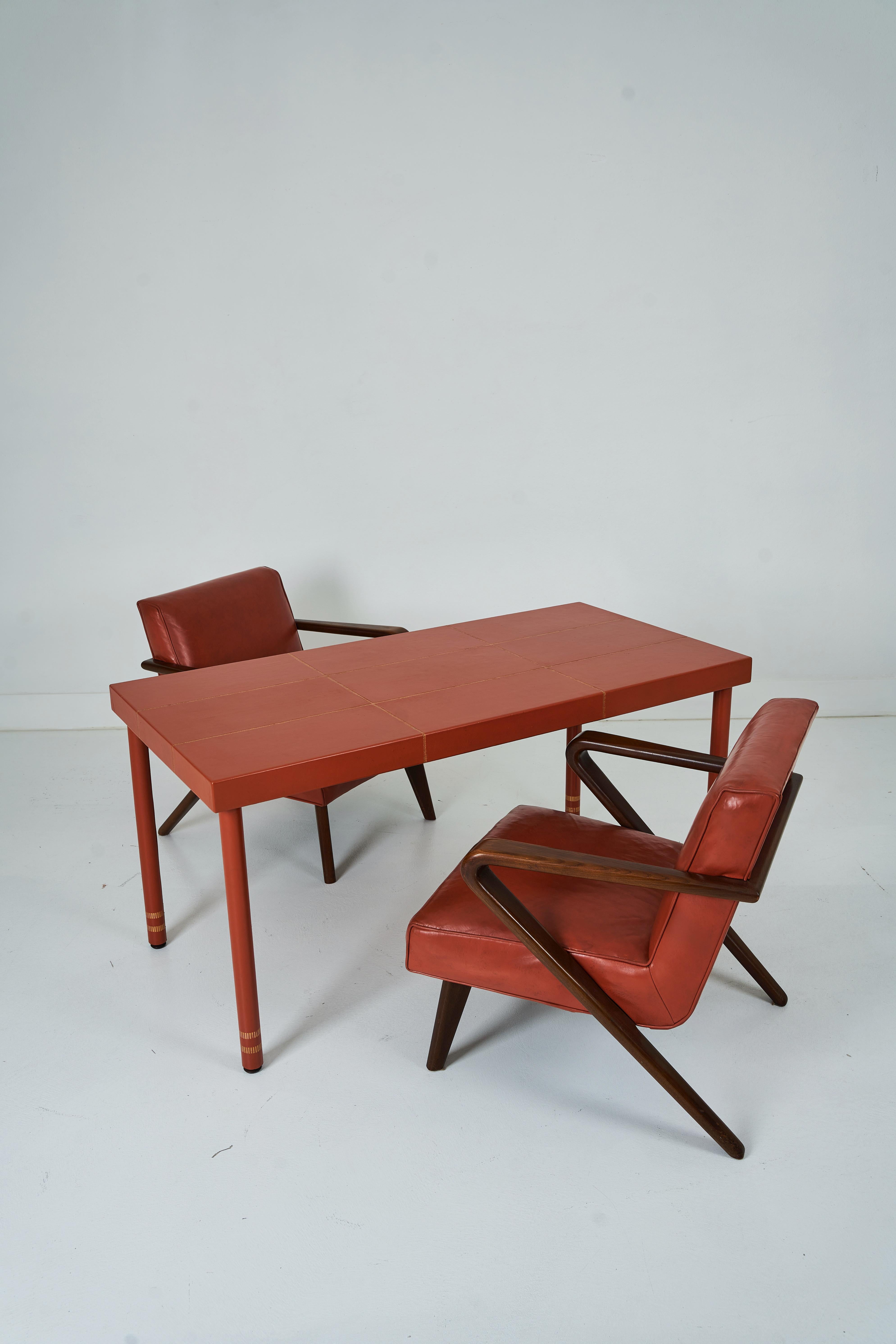 American A Leather Wrapped Desk and Matching Arm Chairs designed by William Haines