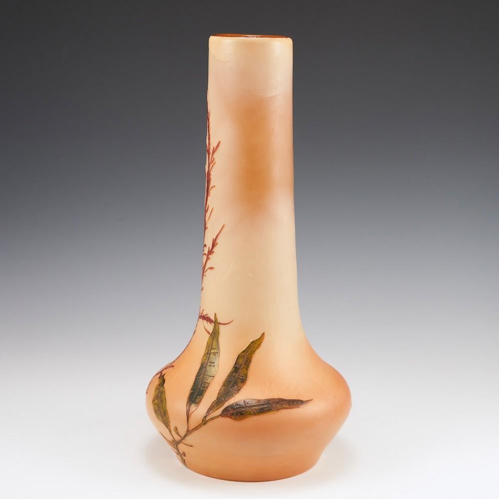 A Legras Cased and Acid Cut and Enamelled Glass Vase, c1920

Additional information:
Date : Circa 1920
Origin : St Denis, France
Features : The pale salmon pink overlay cut back and colour enamelled with red and green leaved aquatic plants
Marks :