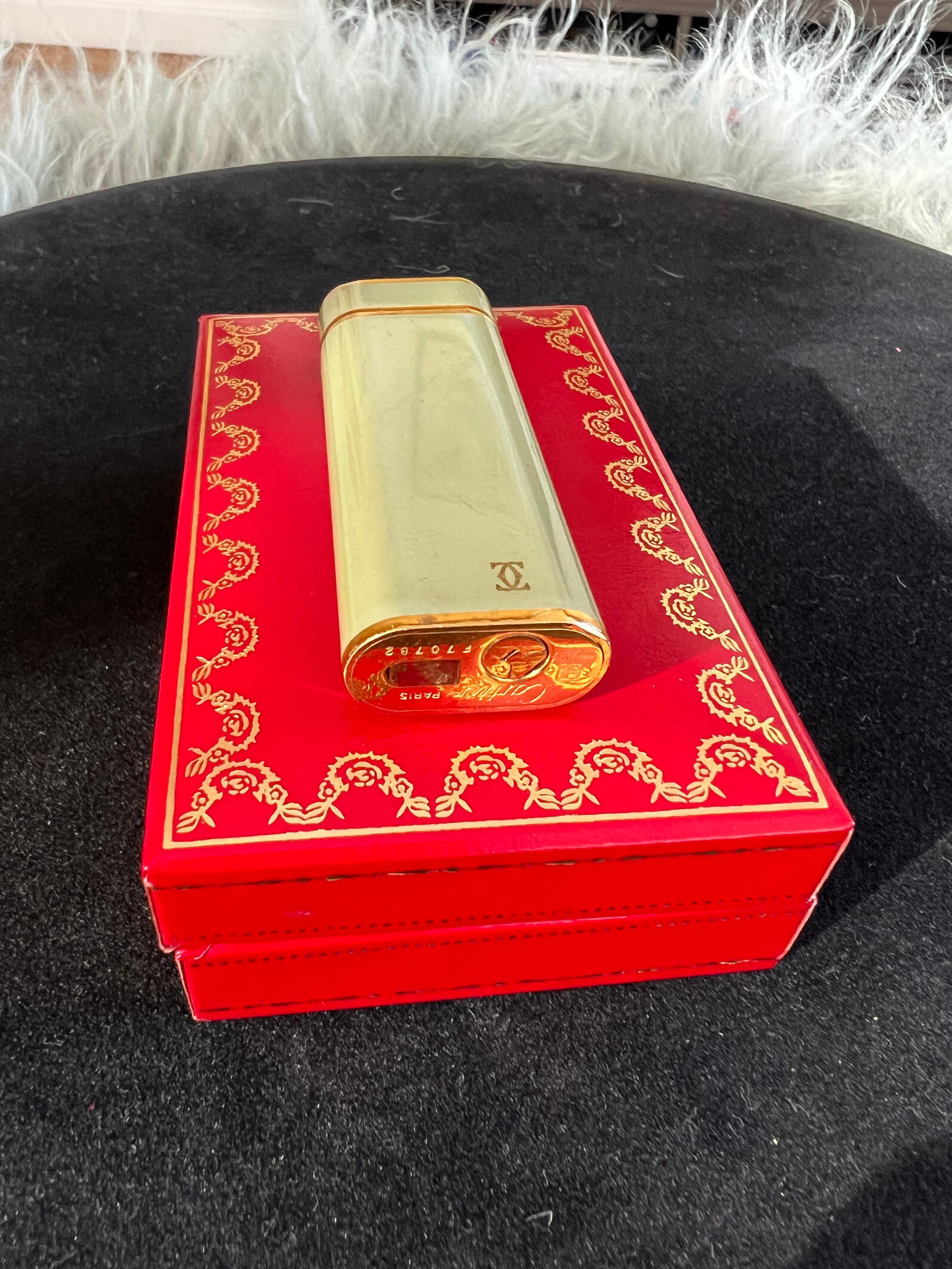 A Les Must De Cartier Paris 18k gold plated and Olive Chinese lacquer lighter 6