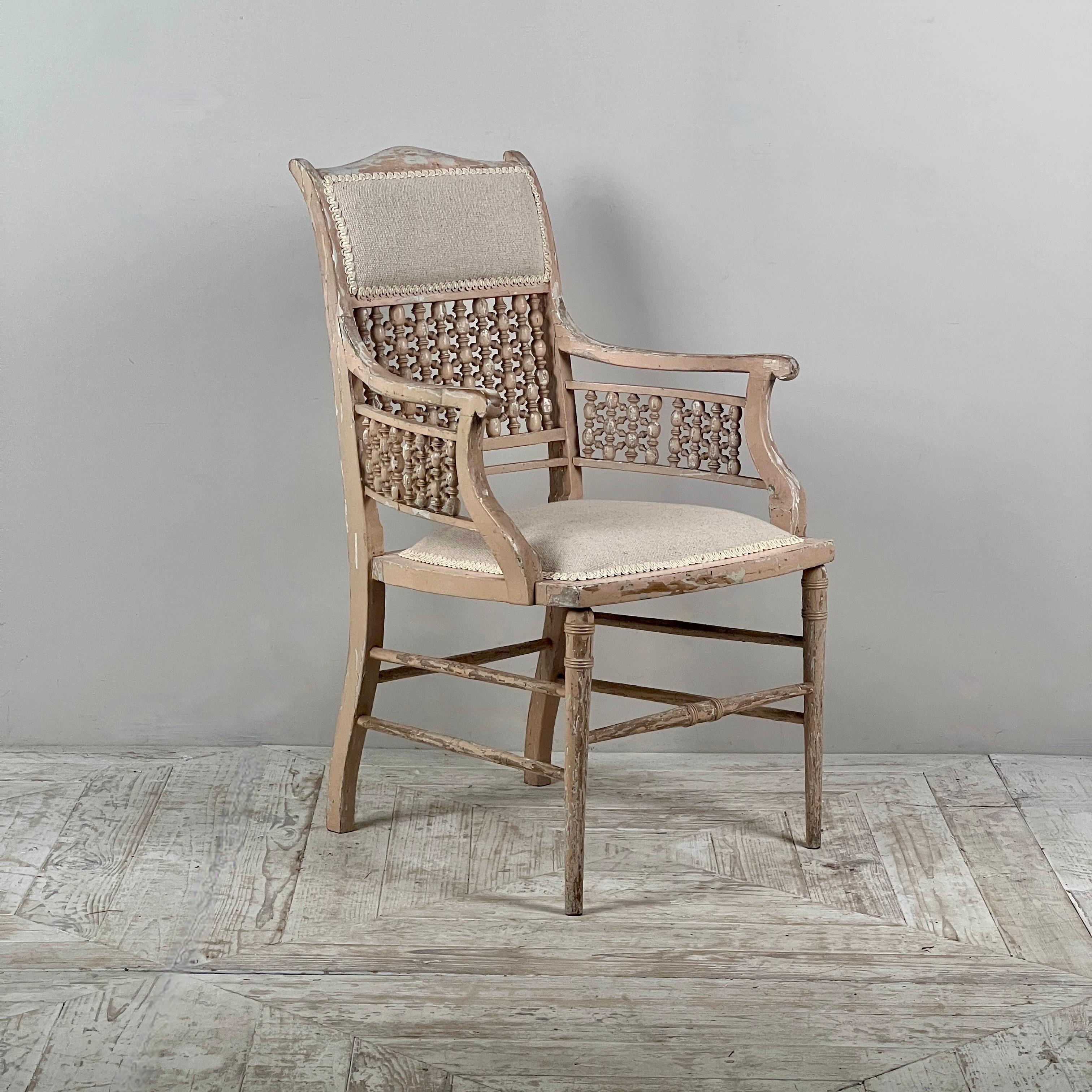 A Liberty & Co. Moorish Arts and Crafts Armchair, Attributed to William Birch

This beautiful armchair, dating from the late 19th to early 20th century, is a charming example of the craftsmanship associated with Liberty & Co. and the Arts and Crafts
