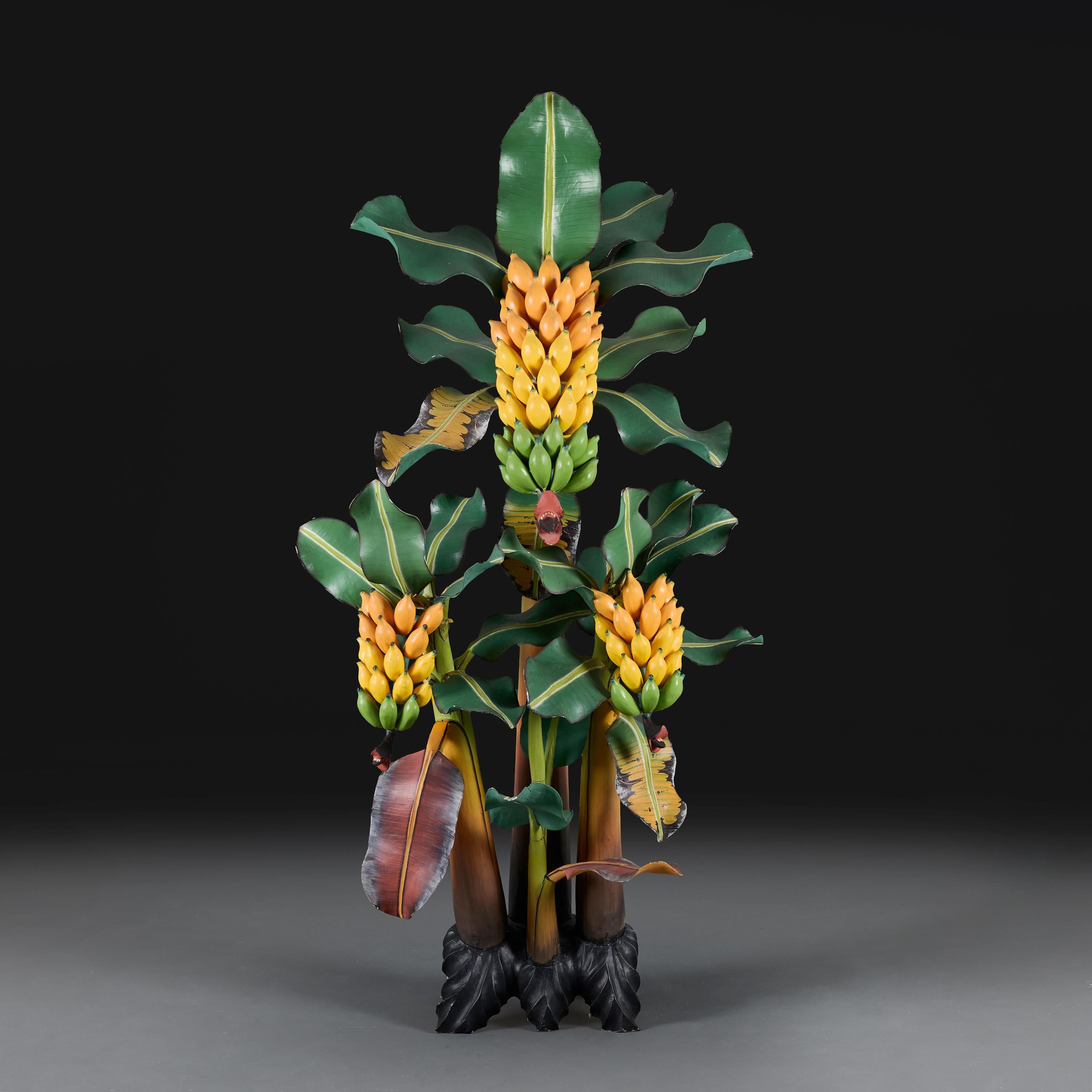 Italy, circa 1950

An unusual mid twentieth century carved wooden banana tree plant, with variegated leaves and hanging fruit, constructed in segmented form, of large scale, supported on a played base. 

Height 178.00cm
Width  88.00cm
Depth 