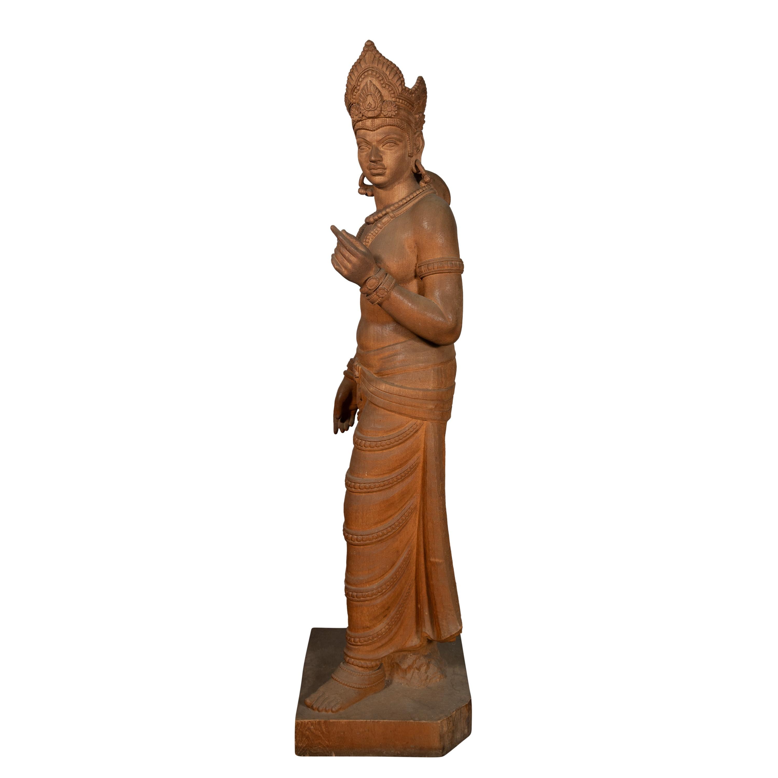 A life-size carved wood sculpture of the Hindu goddess Parvati. Parvati, the consort of Lord Shiva, is often depicted as a symbol of divine strength, love, and fertility in Hindu mythology.

The sculpture depicts goddess Parvati with distinct