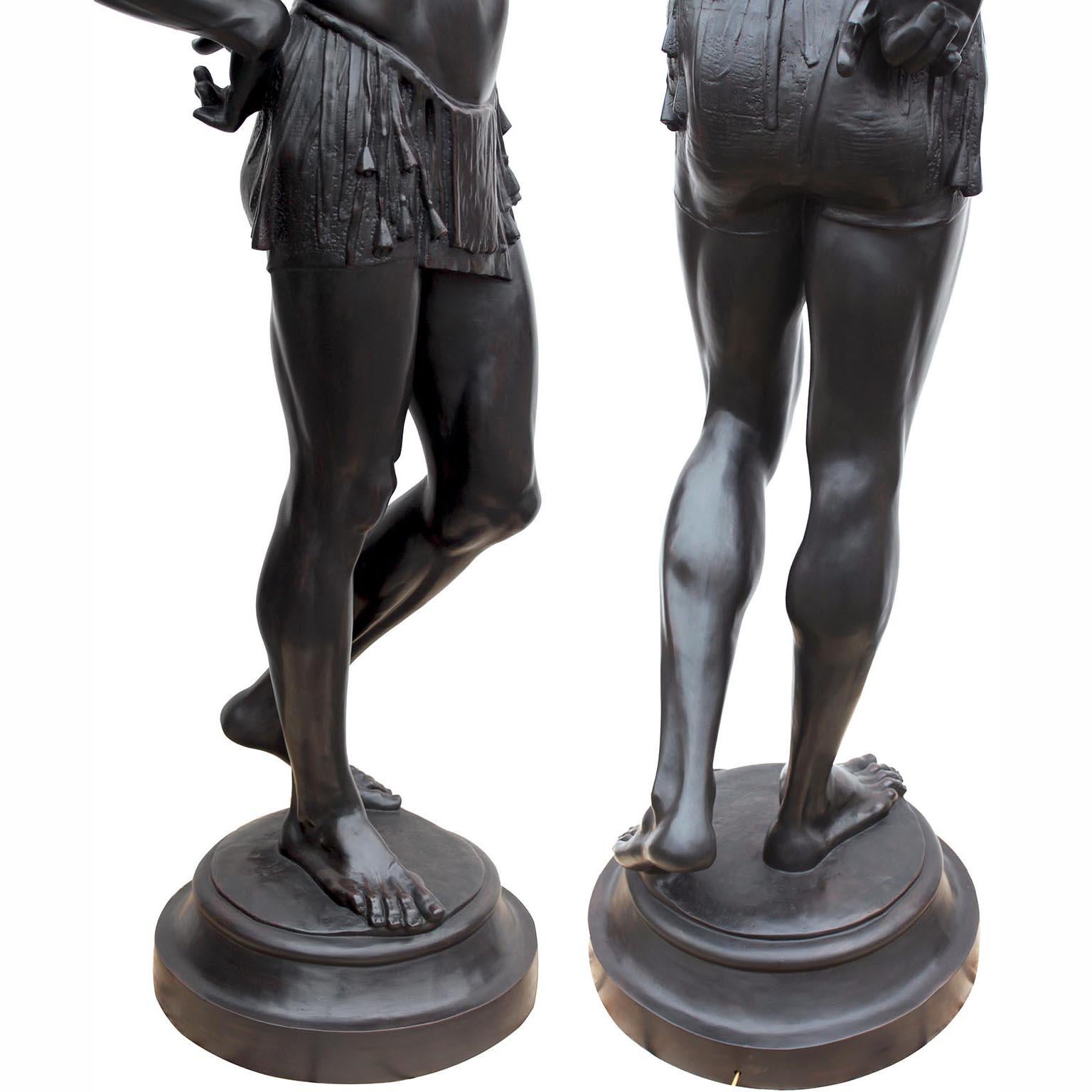 A Life-Size Pair French Cast-Iron Torchères Sculptures Juggler & Serpent Charmer For Sale 4