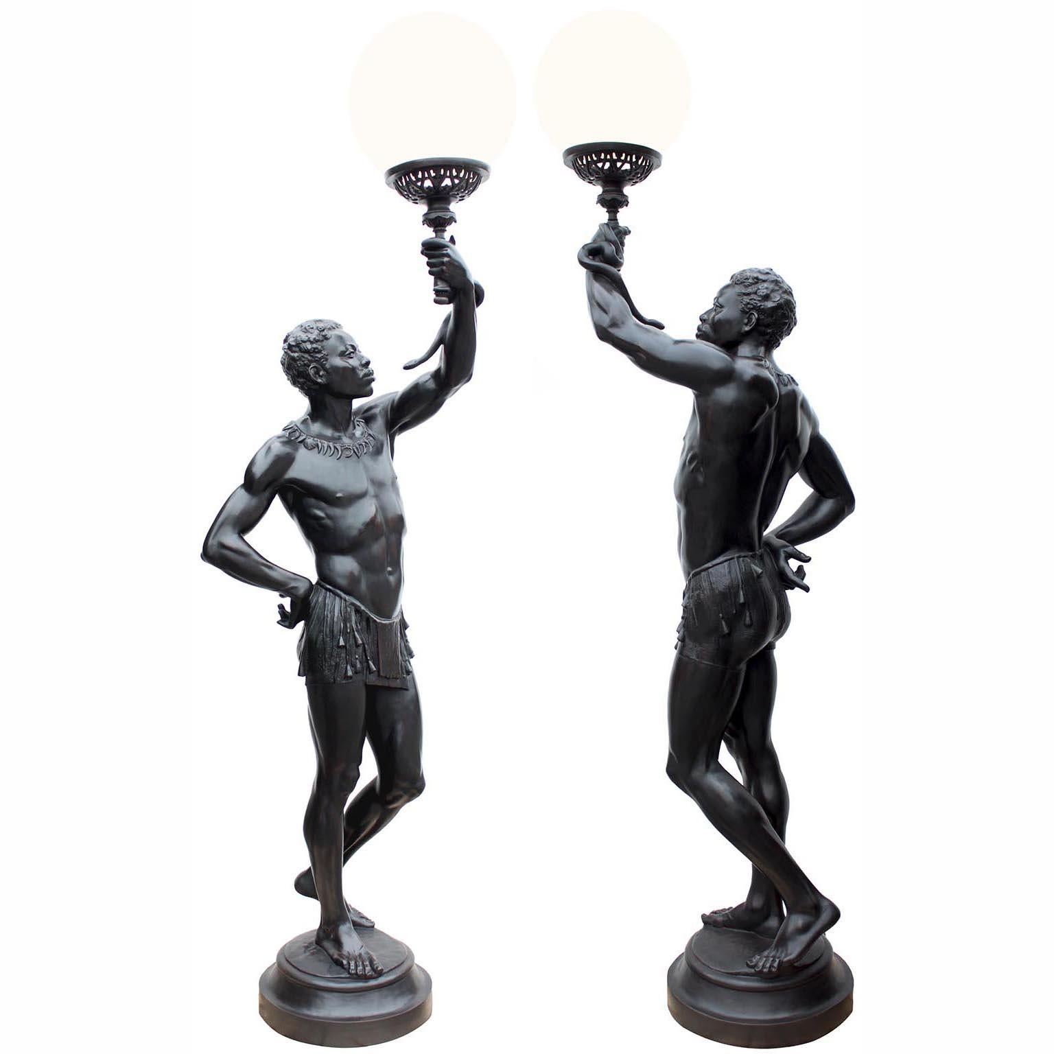 A Palatial Life-Size Pair of French 19th-20th Century Cast-Iron Torchères Sculpures figures of 