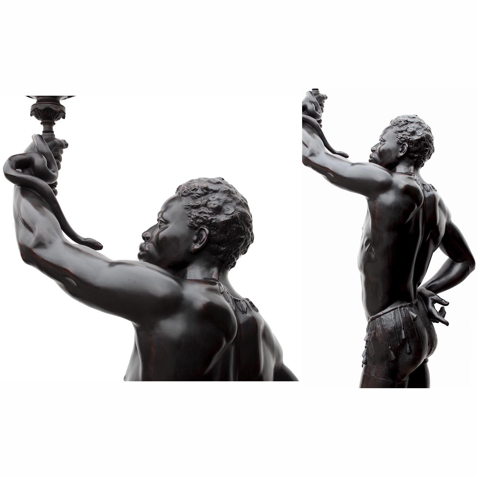 A Life-Size Pair French Cast-Iron Torchères Sculptures Juggler & Serpent Charmer For Sale 2