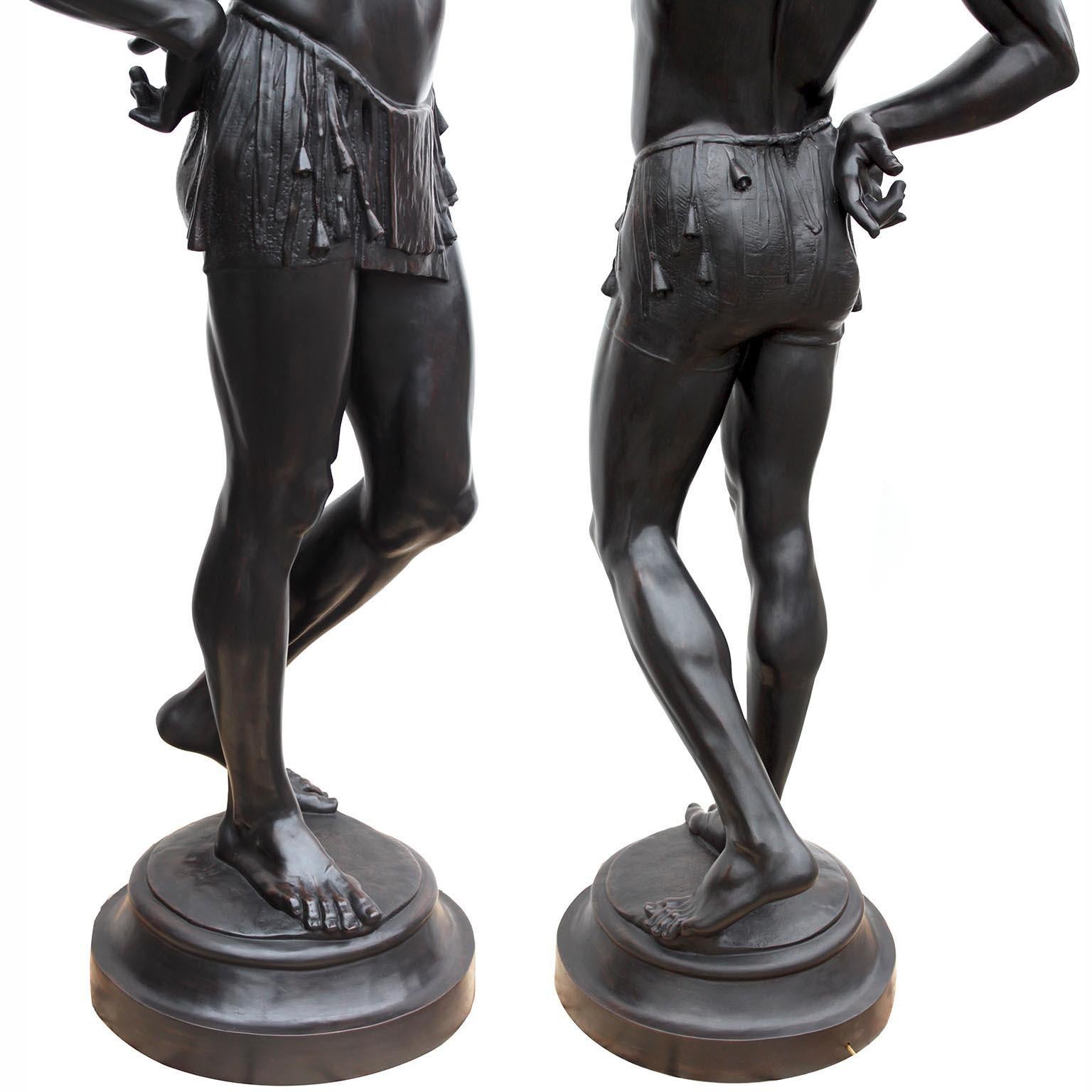 A Life-Size Pair French Cast-Iron Torchères Sculptures Juggler & Serpent Charmer For Sale 3
